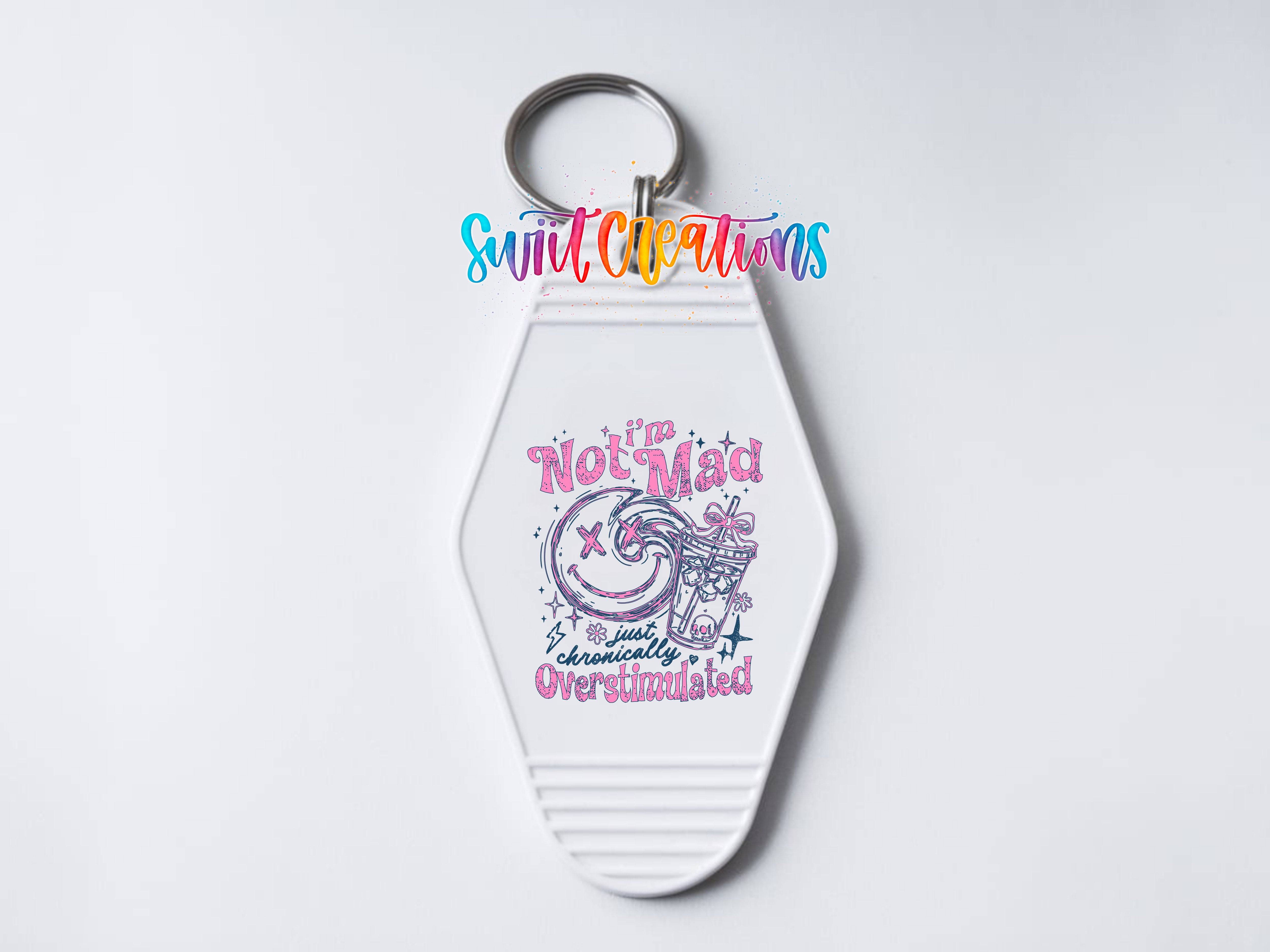 A keychain with a colorful design and text on it.
