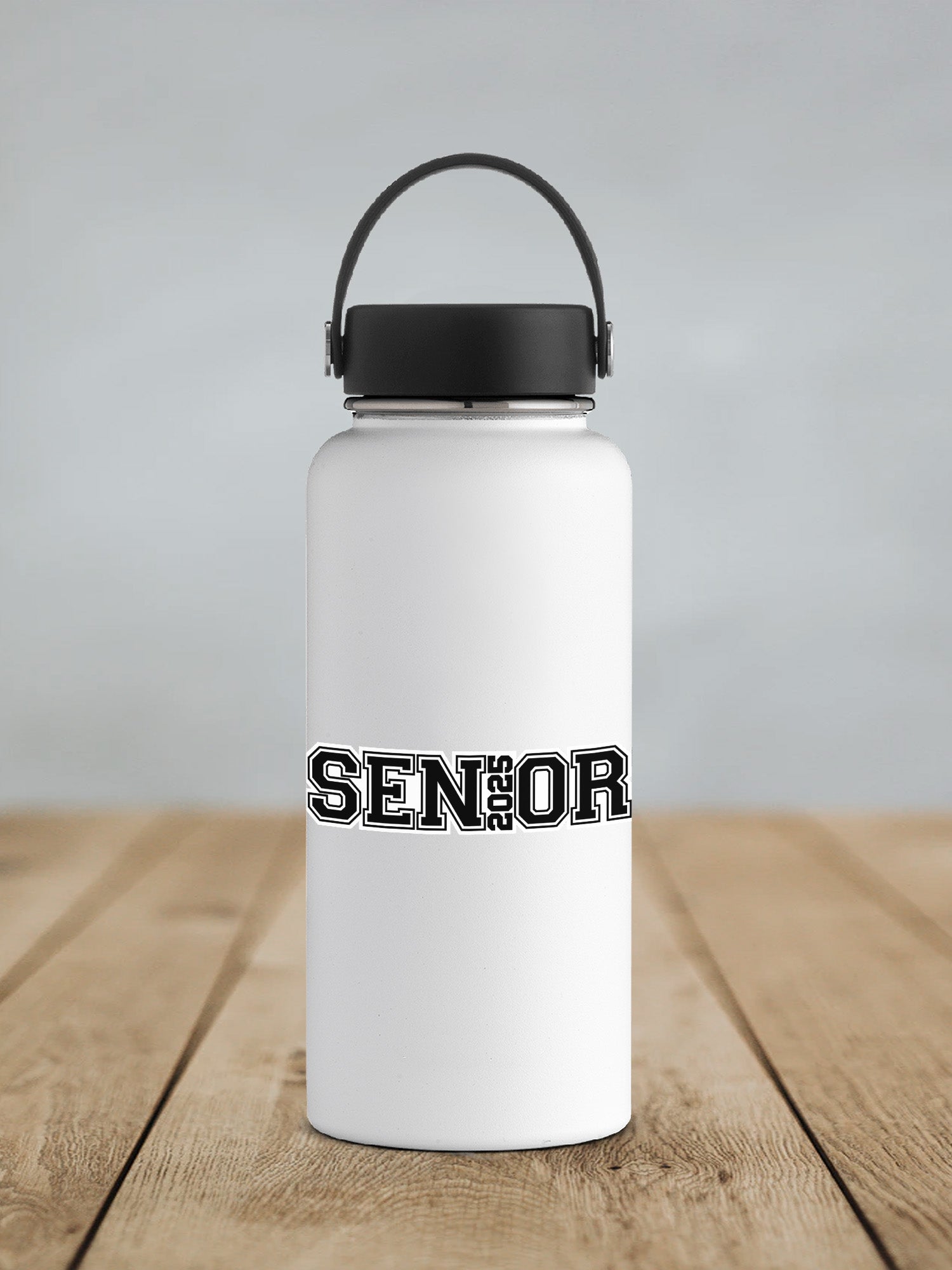 a white water bottle sitting on top of a wooden table