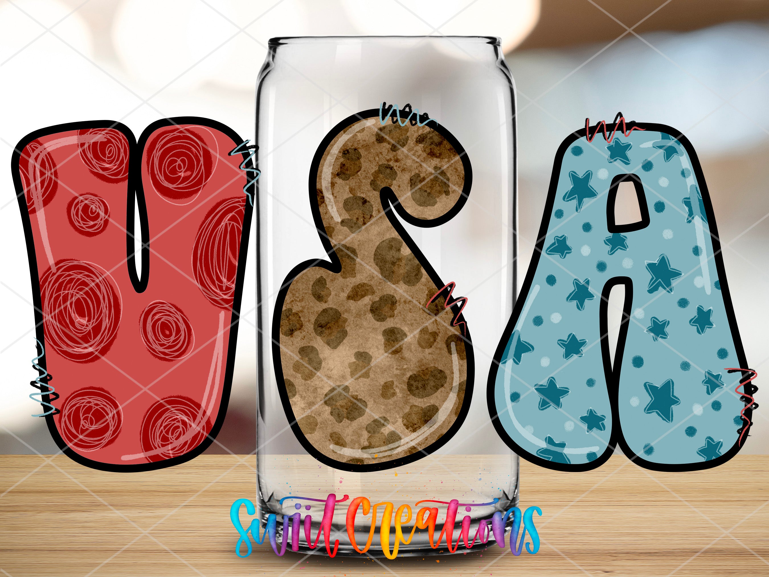 a glass with a cookie in the shape of the letter b and a cookie in