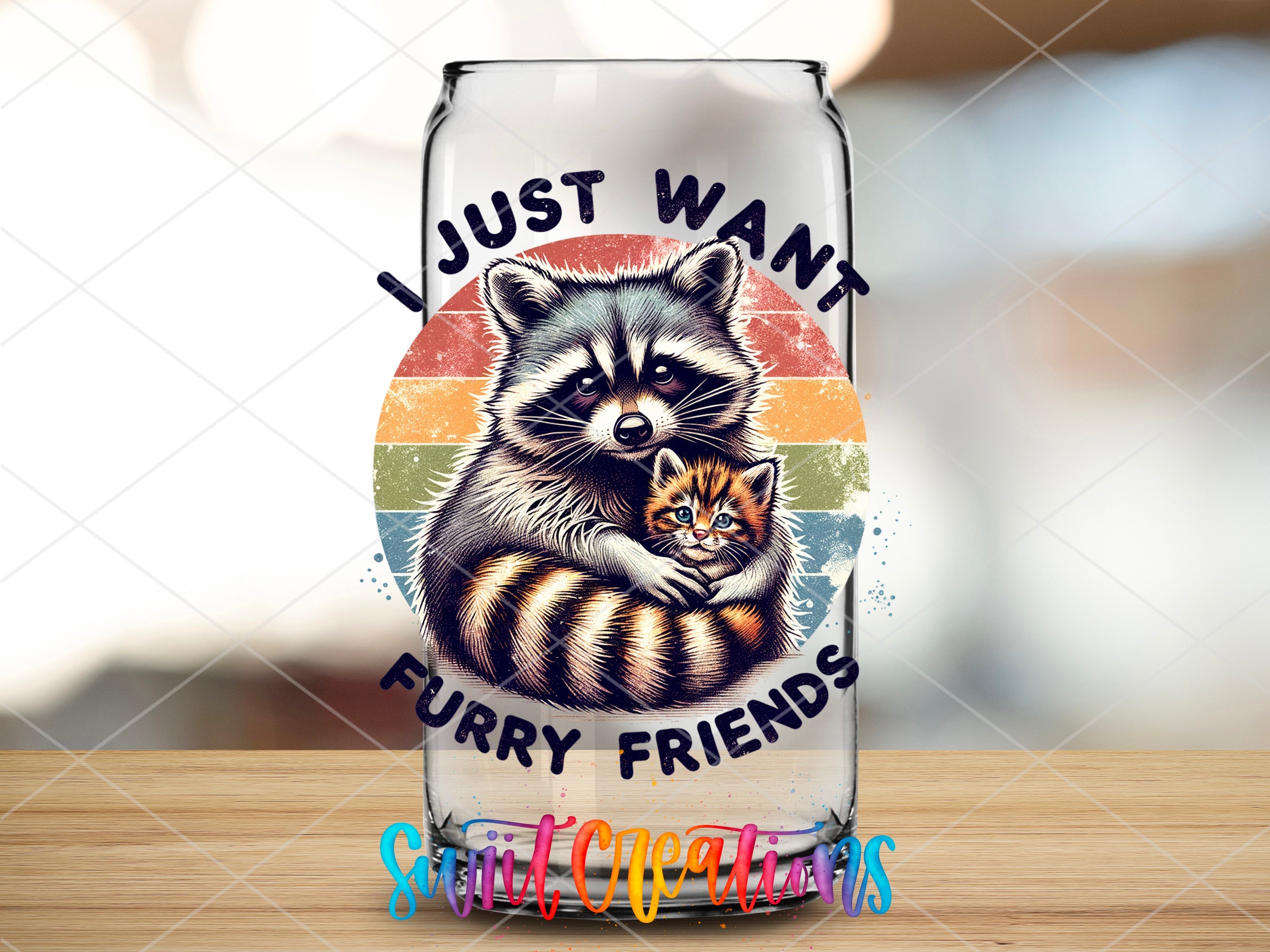a glass with a raccoon and a kitten on it