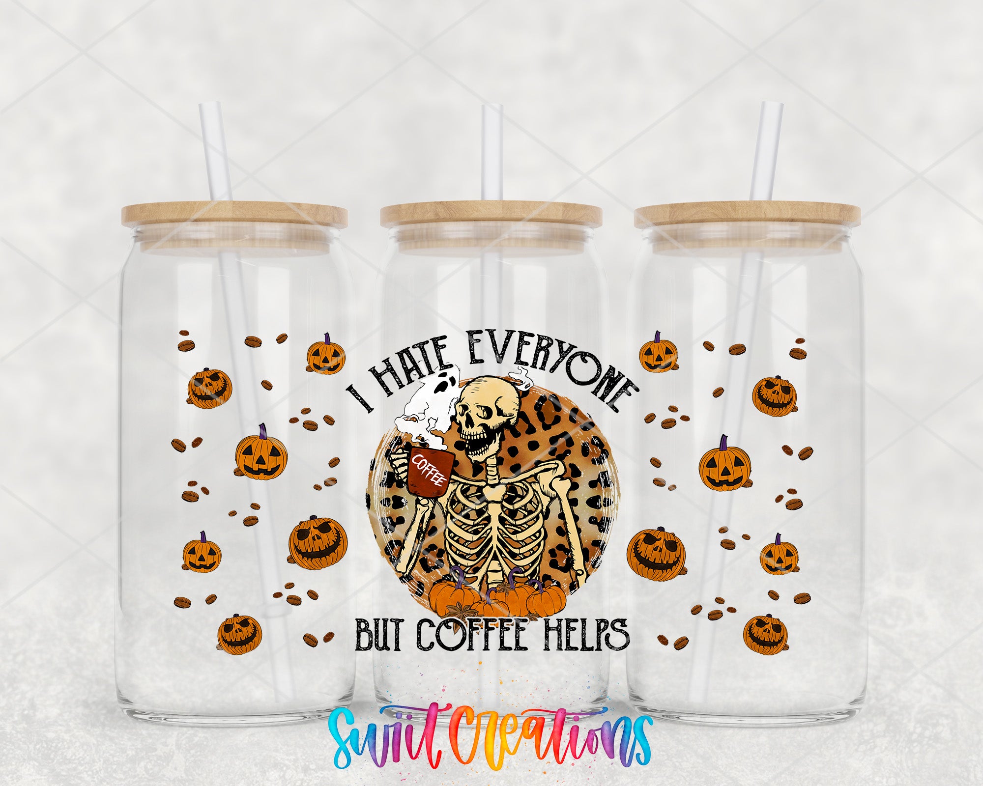 three clear glass tumblers with a skeleton design and Halloween pumpkins printed on them. The text on the tumblers reads "I HATE EVERYONE BUT COFFEE HELPS" and is located in the center of the image.