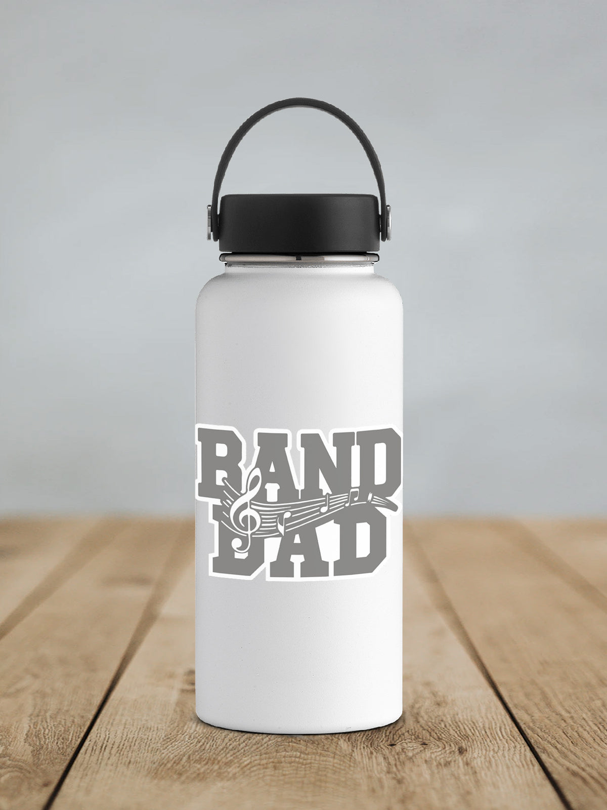 a white water bottle sitting on top of a wooden table