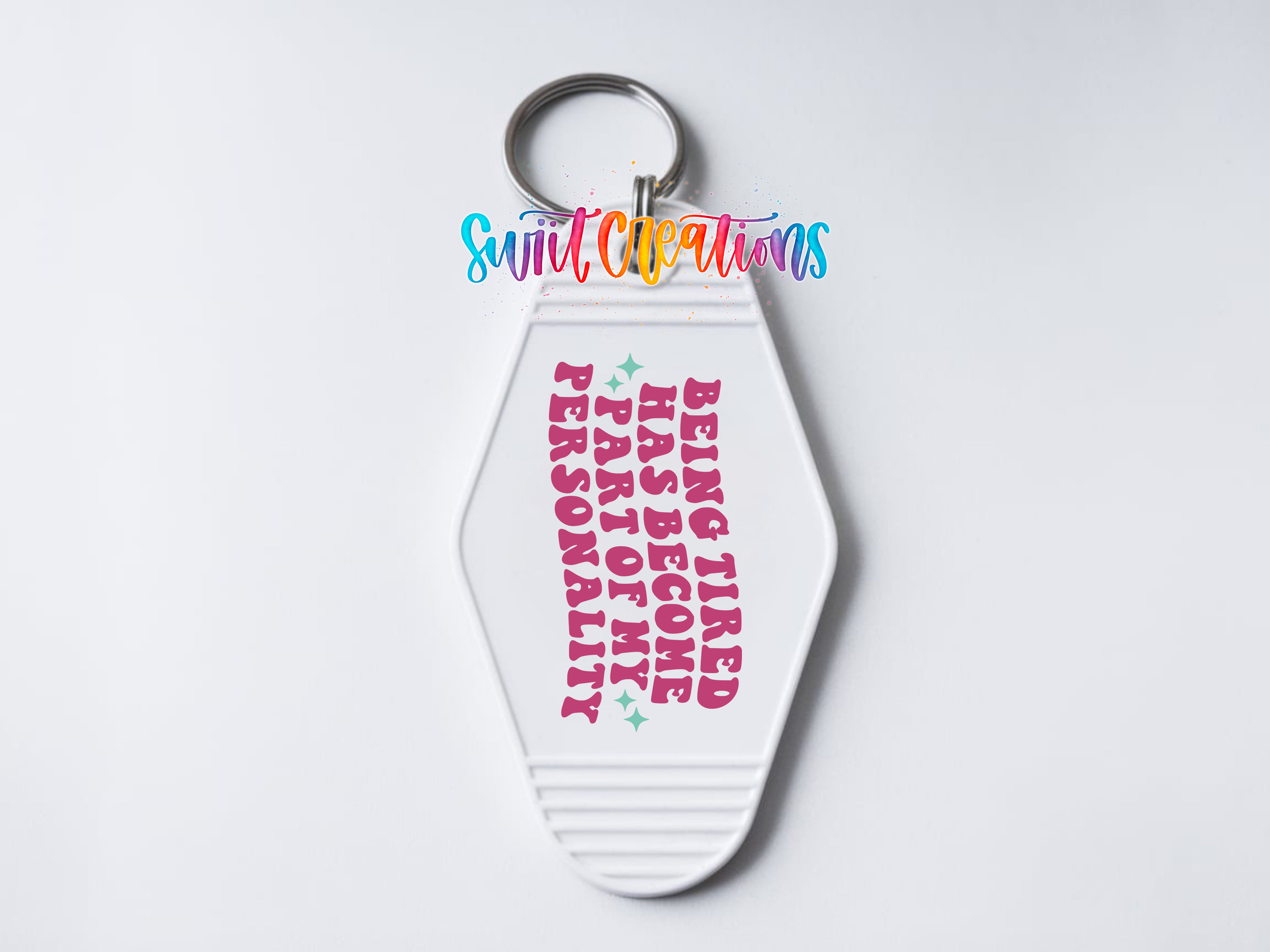 A keychain with a message printed on it.