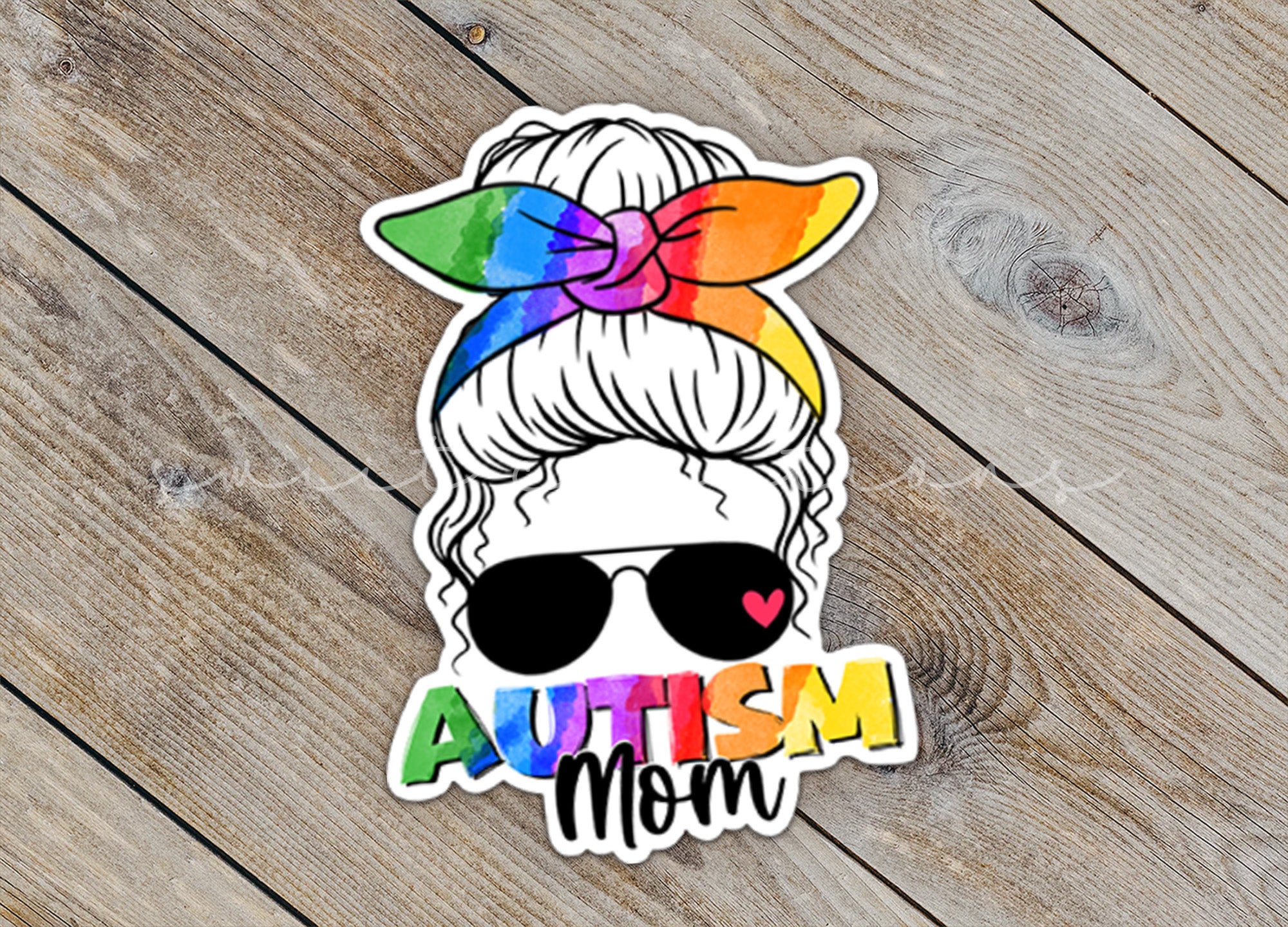 a sticker with the words autism mom on it