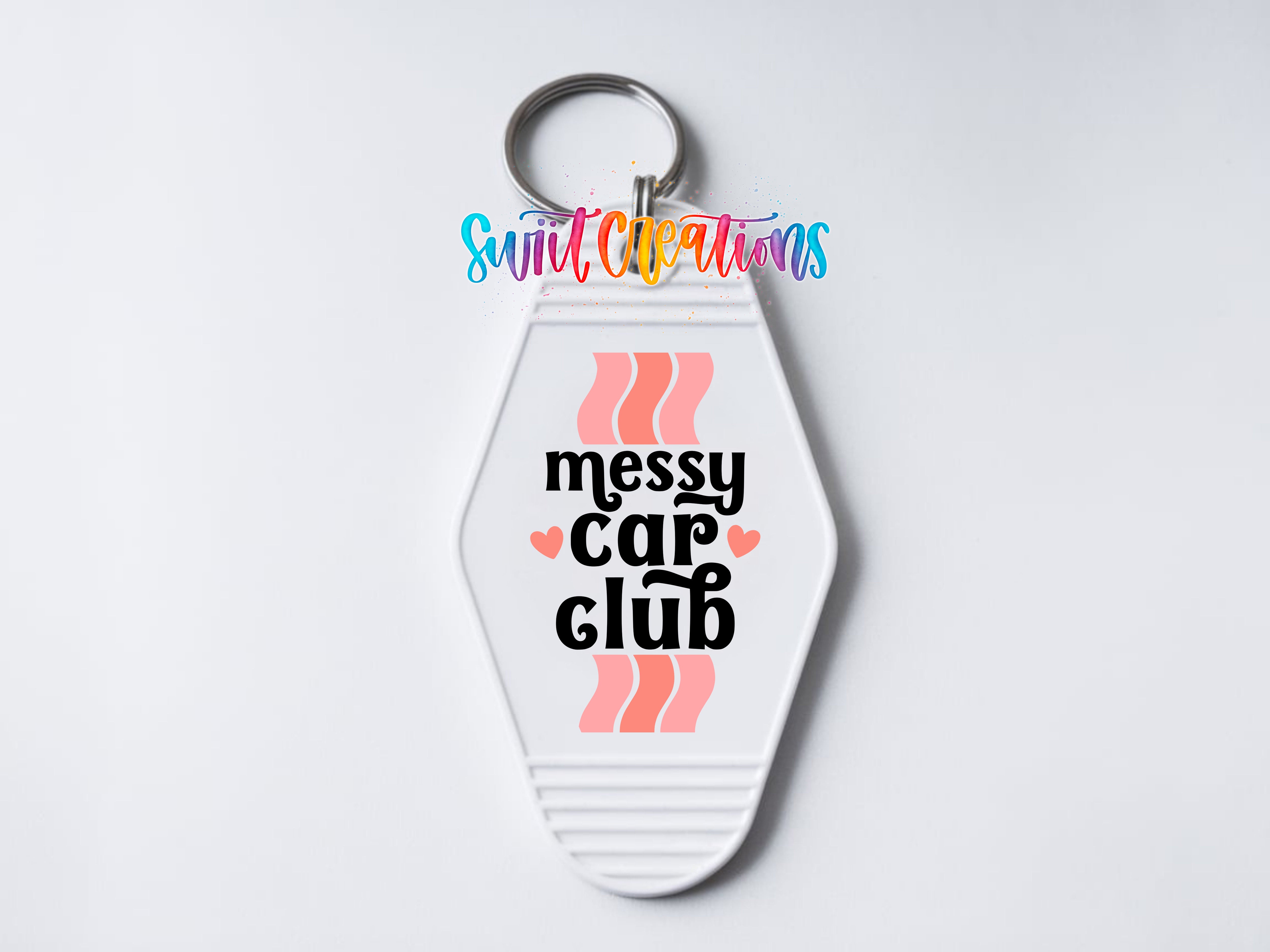 A keychain with the text "messed up car club" printed on it.