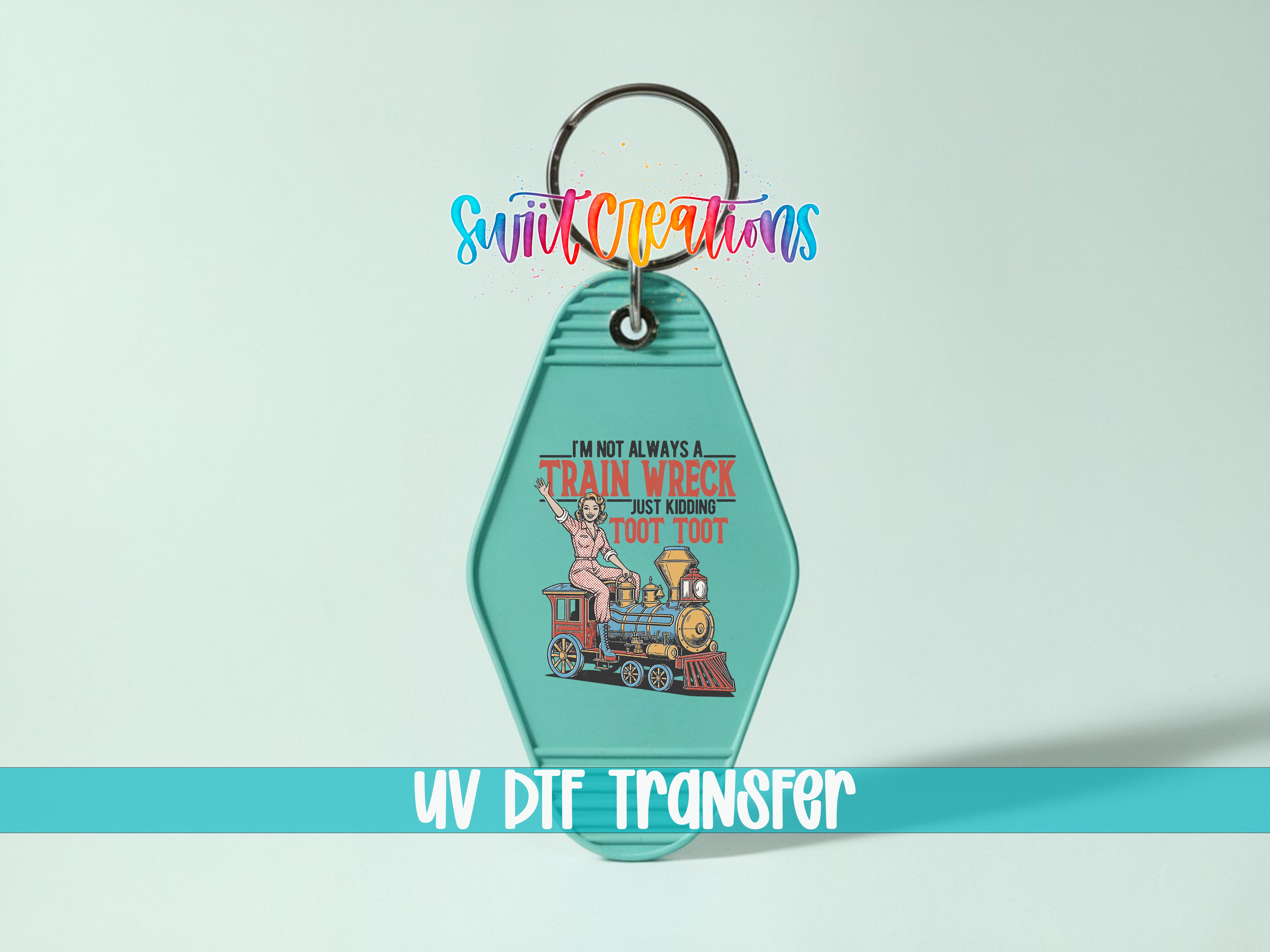 A keychain with a colorful graphic design and text, including a train and a woman.
