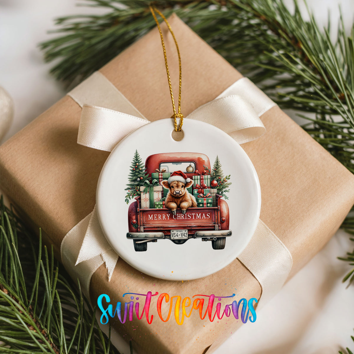 A ceramic ornament featuring a red truck with a Santa hat and presents in the back, hanging on a ribbon.