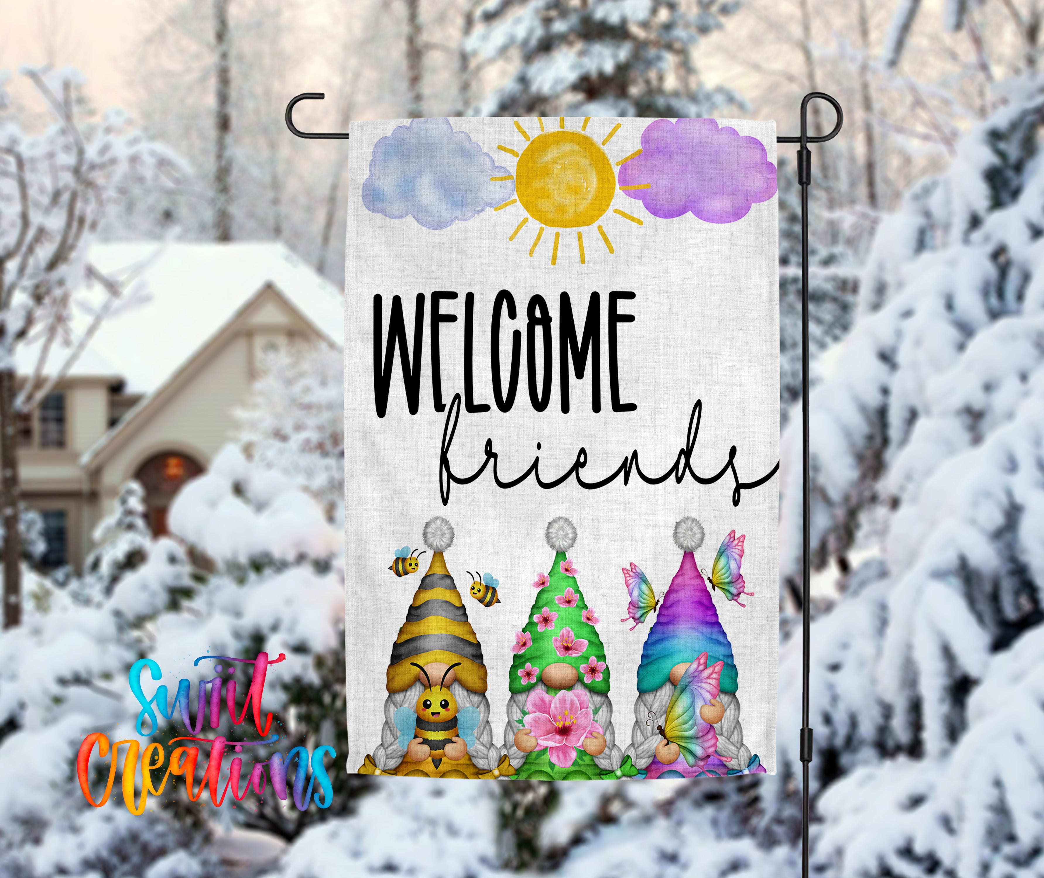 A colorful welcome sign featuring cartoon gnomes and flowers, with a snowy background and a house in the distance.