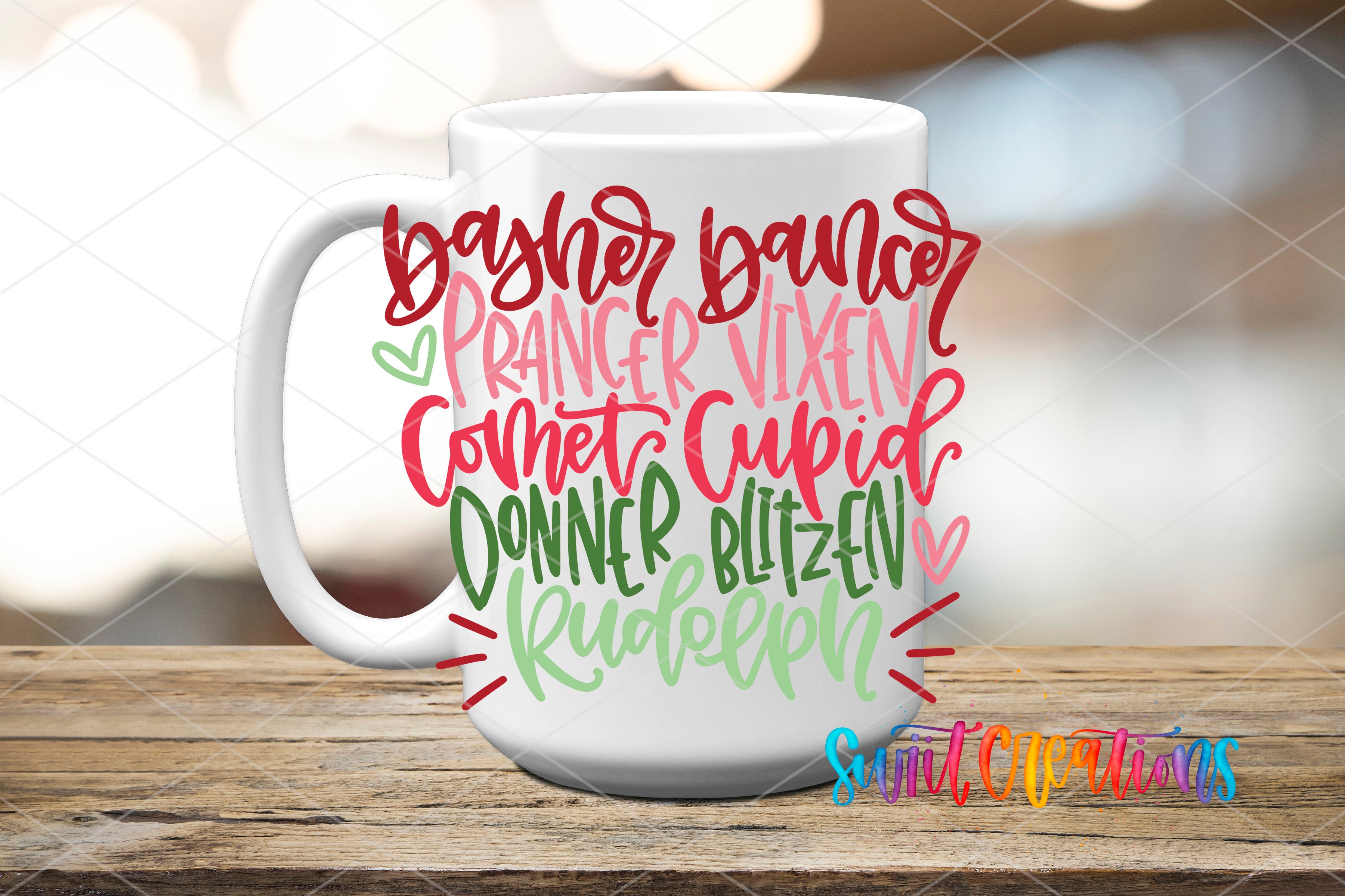 A white mug with colorful text printed on it, sitting on a wooden surface.