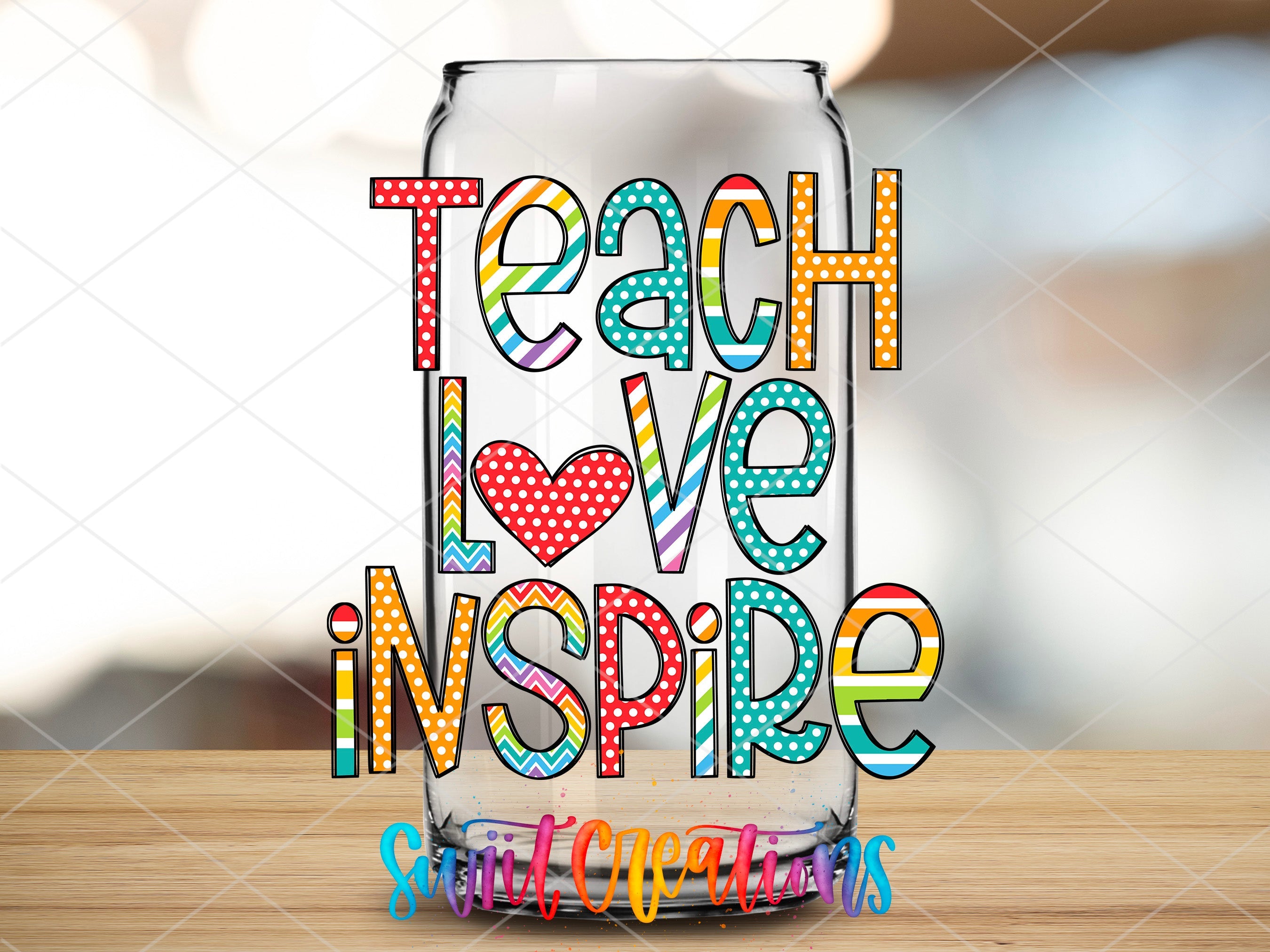 a glass with the words teach love inspire on it