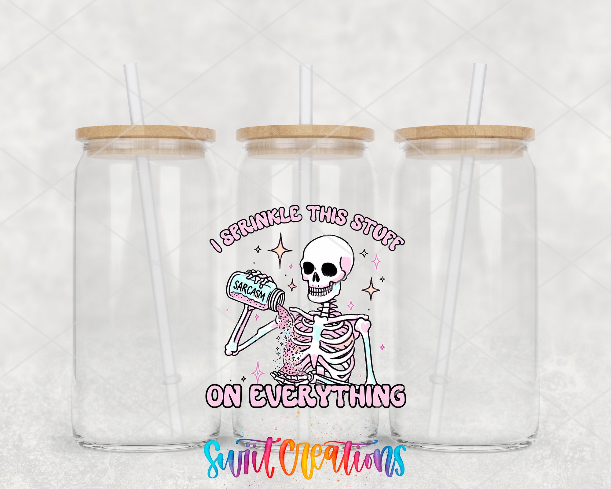 two clear tumblers with a skeleton holding a toothbrush