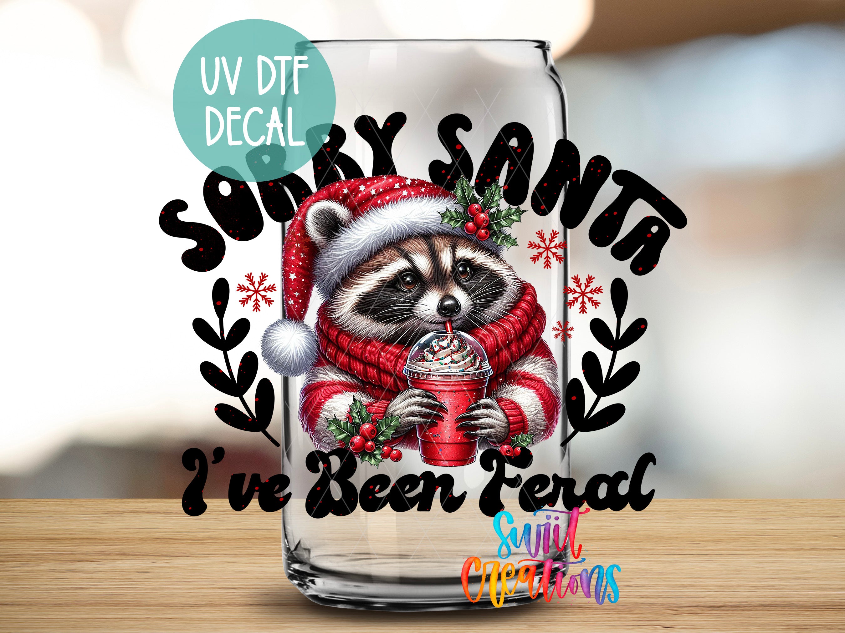 a glass with a picture of a raccoon drinking from a cup