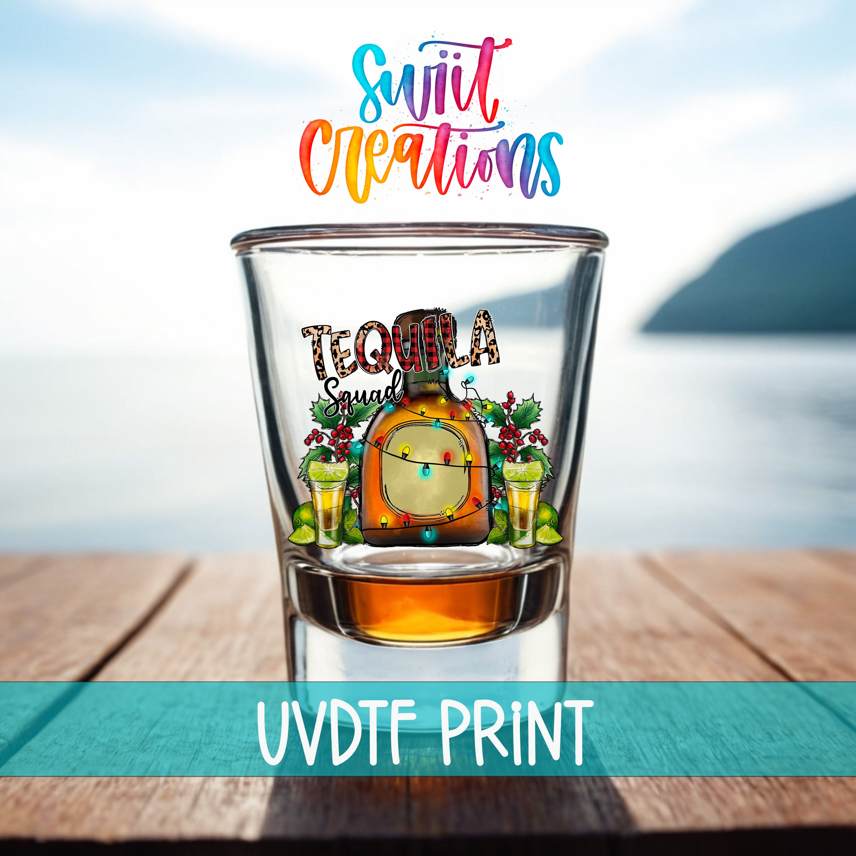 A colorful glass with a tequila-themed design, featuring a tequila bottle, tequila shot glasses, and a festive Christmas tree. The text "Suit Up Capations" is written above the glass, and "UVDF PRINT" is written below it.