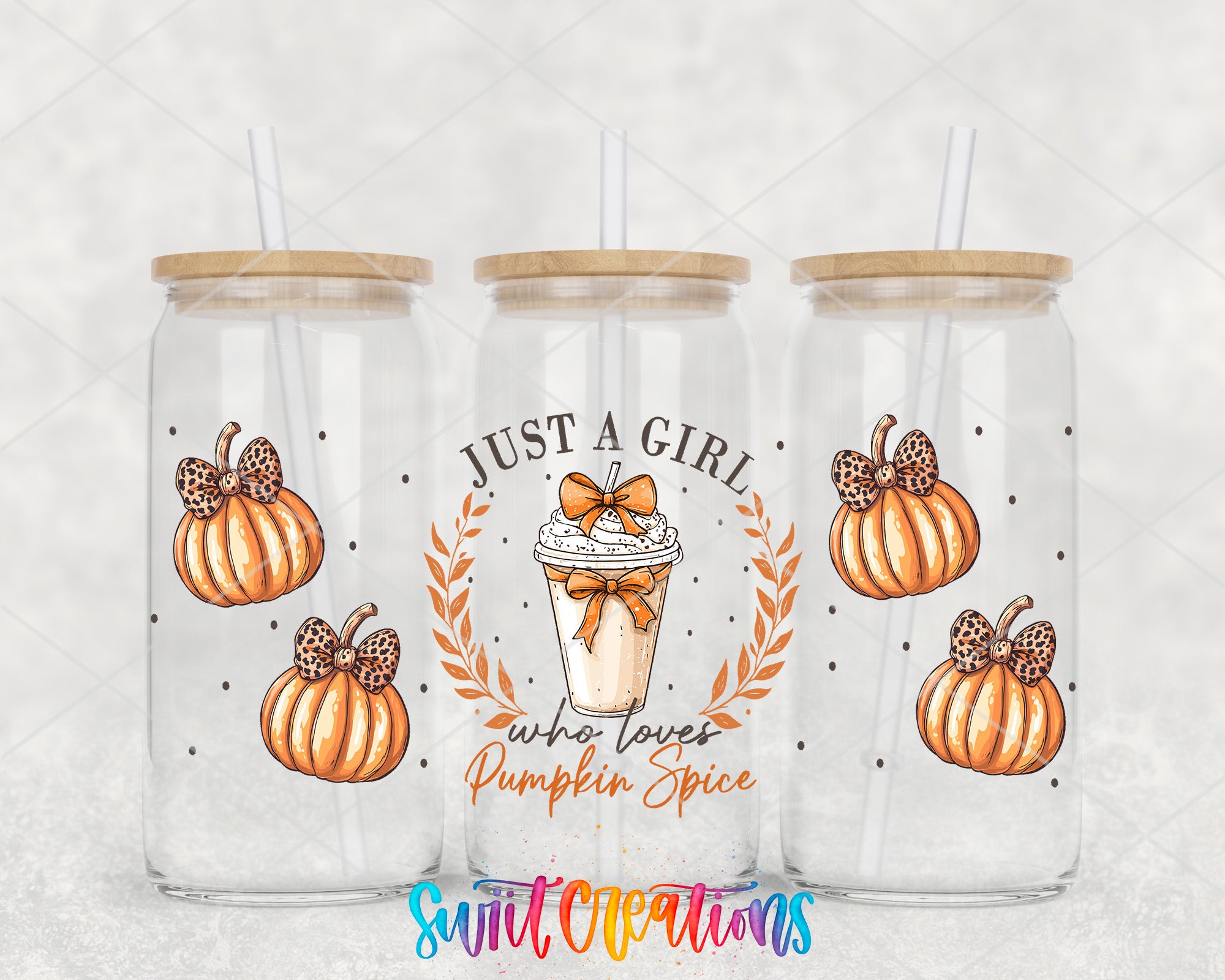 three glass tumblers with pumpkin designs and straws. Each tumbler has a label that reads "Just a girl who loves pumpkin spice".