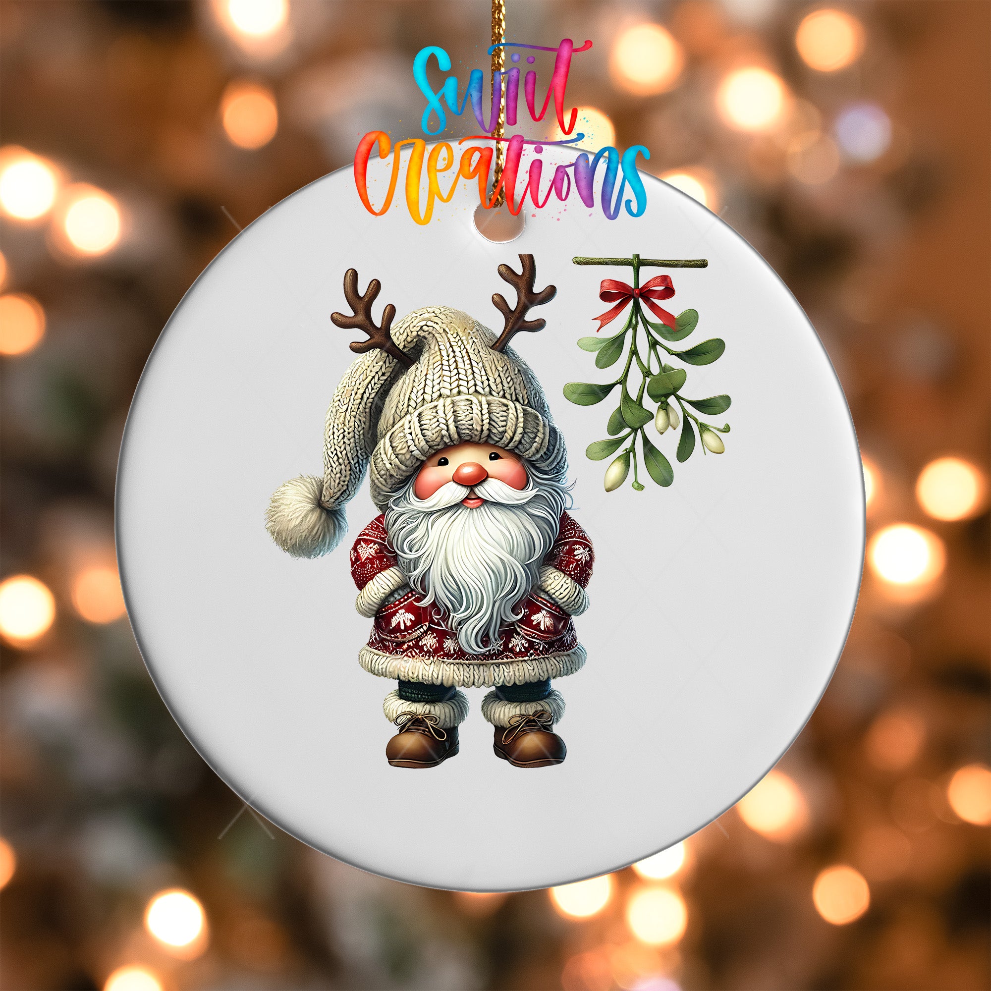 A white ornament featuring a Santa Claus figure with antlers and a mistletoe, set against a blurred background with colorful lights.