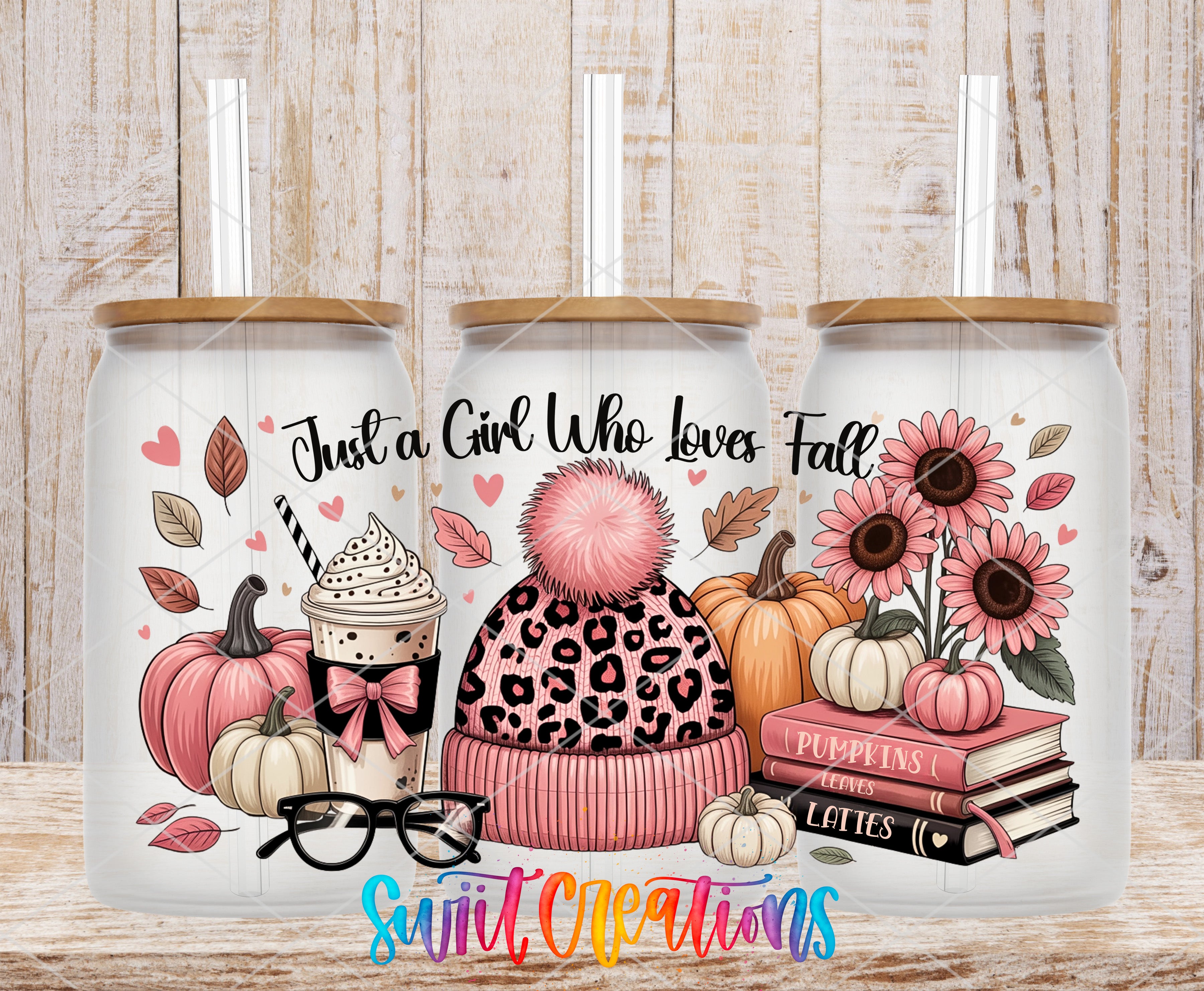 A collection of three glass tumblers with illustrations of fall-themed items, including pumpkins, sunflowers, and a leopard print hat.