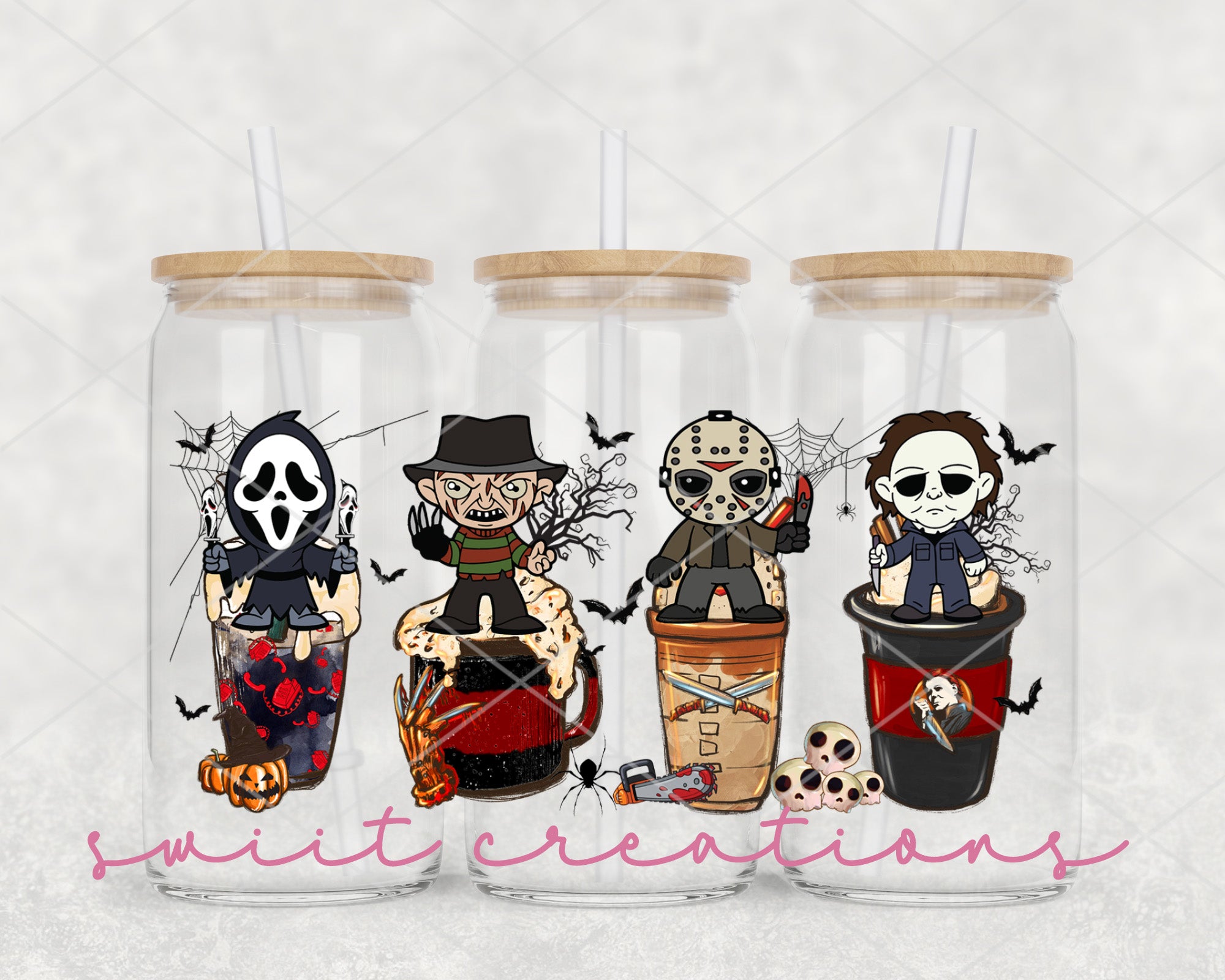 a set of three halloween themed tumblers
