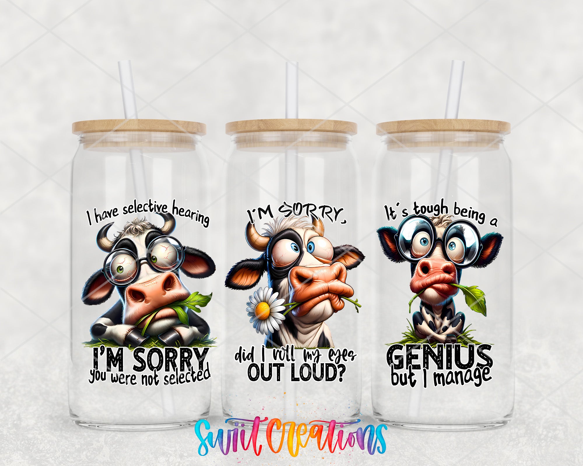 Three glass jars with cow designs and humorous text on them.