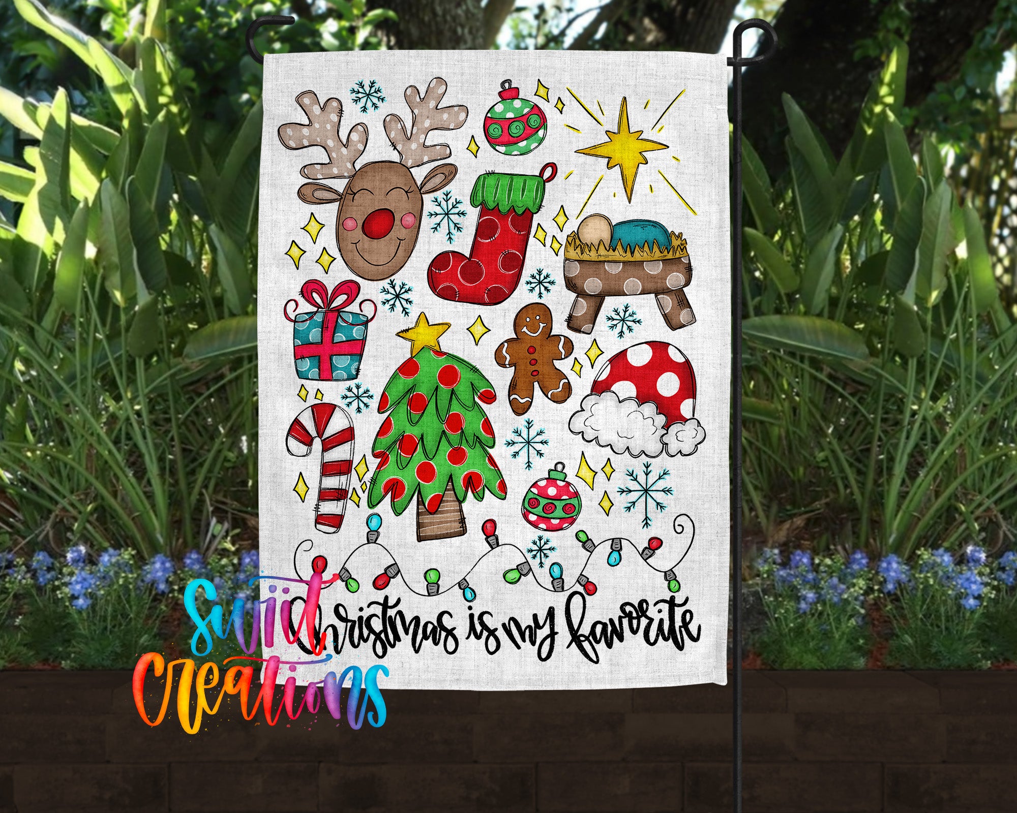 A colorful Christmas-themed flag with various holiday symbols and decorations, including a reindeer, Santa Claus, a nativity scene, a gingerbread man, a snowman, and a star.