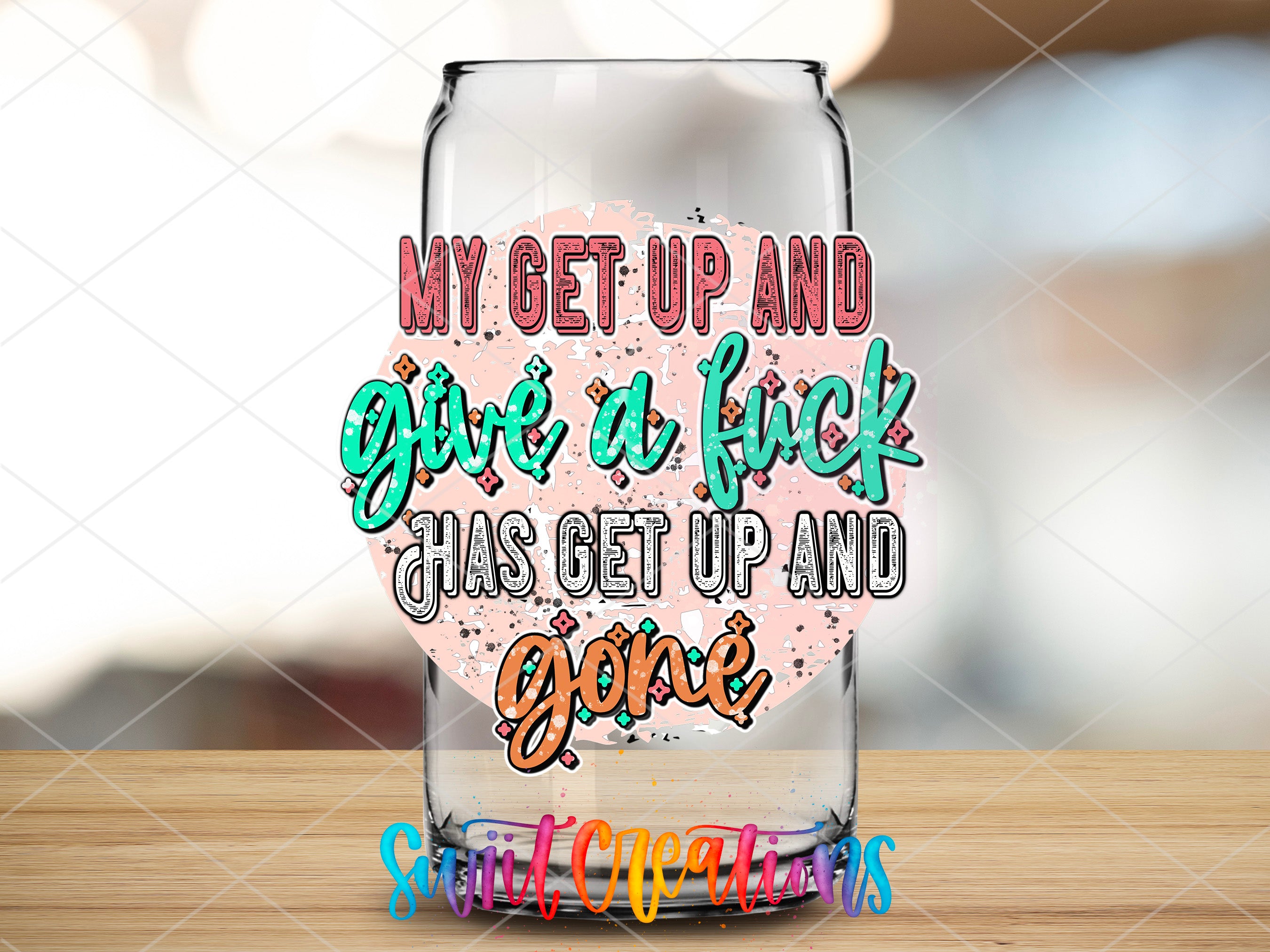 a glass with a message on it sitting on a table