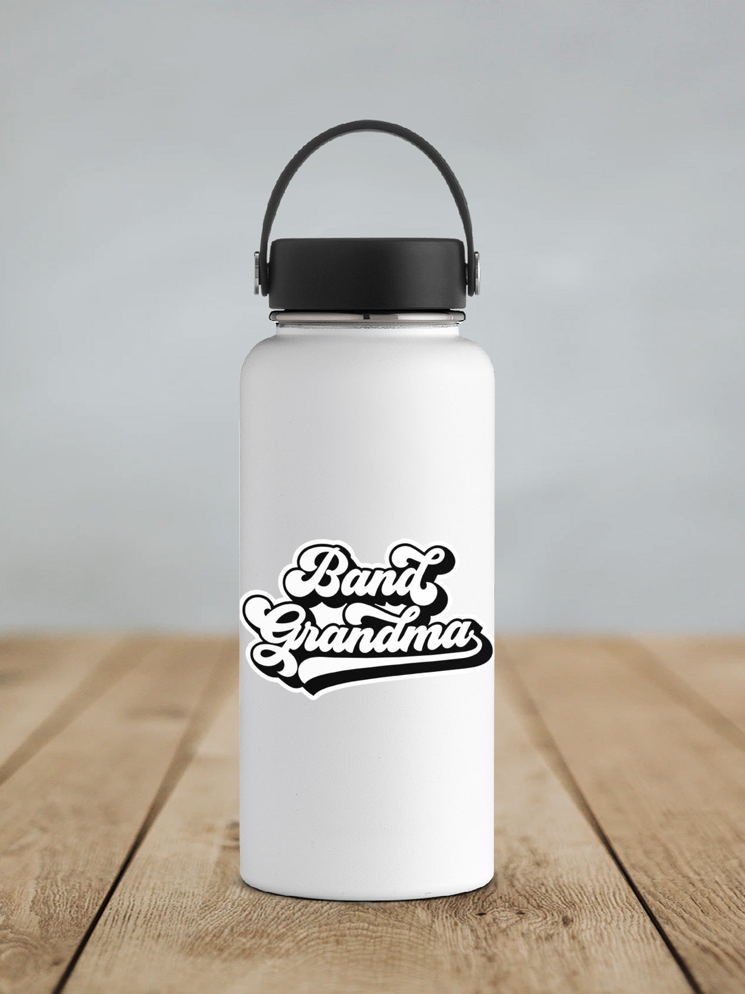a white water bottle sitting on top of a wooden table