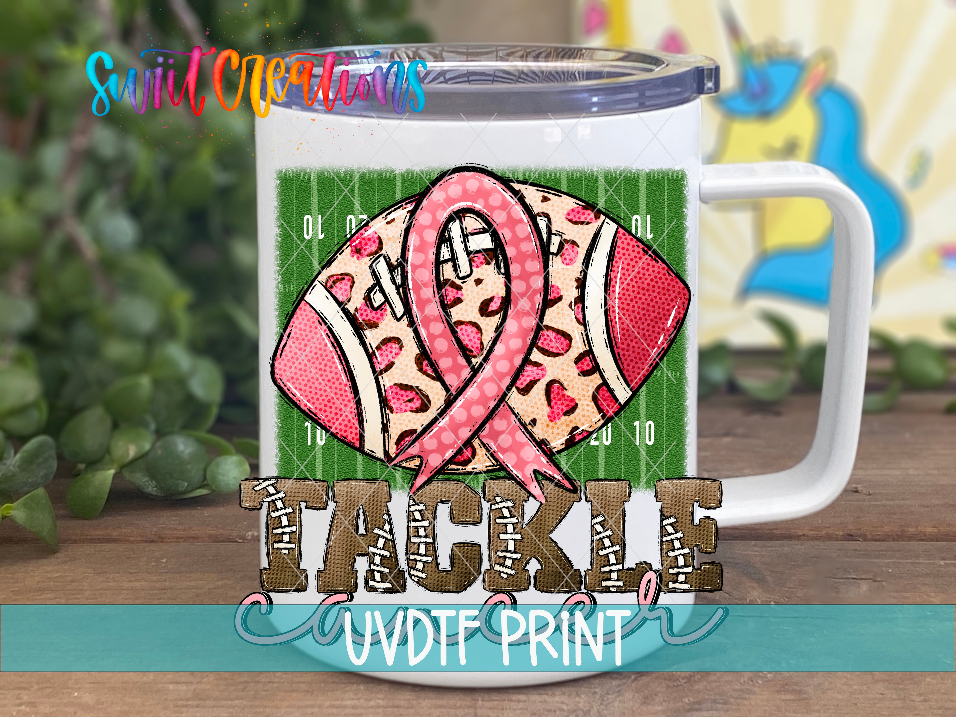 a white coffee mug with a pink ribbon on it
