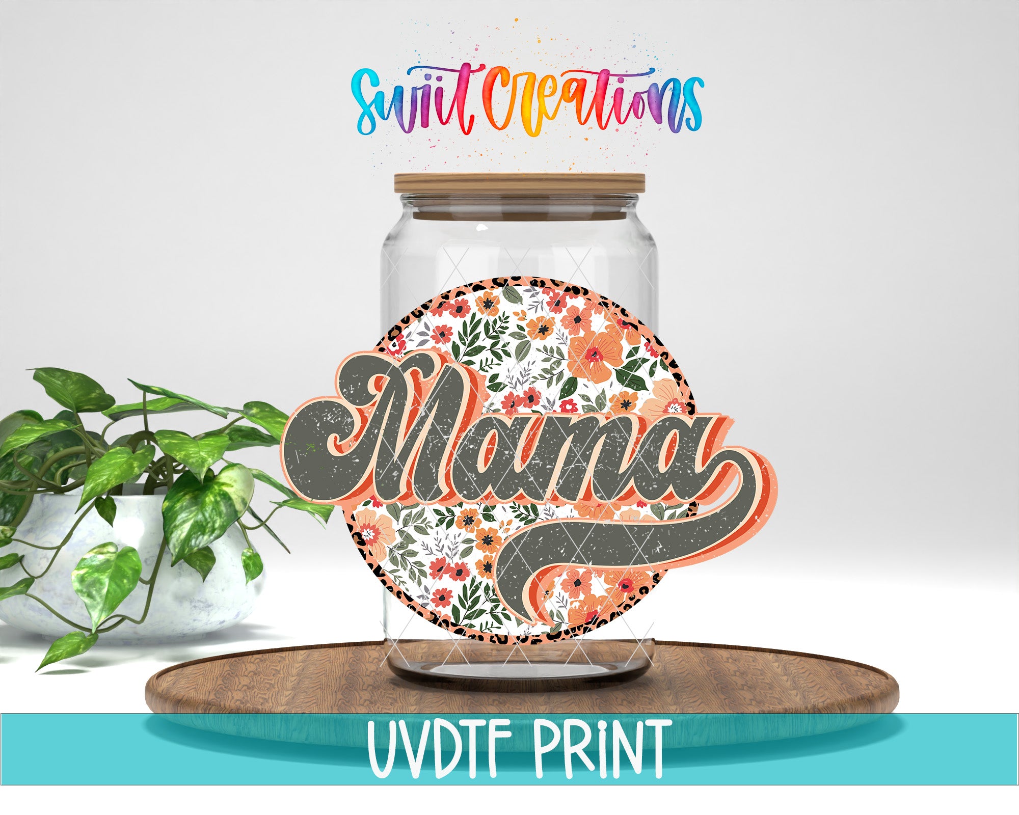 a glass jar with a floral design and the word "Mama" written on it, placed on a wooden surface. There is also a potted plant in the background.