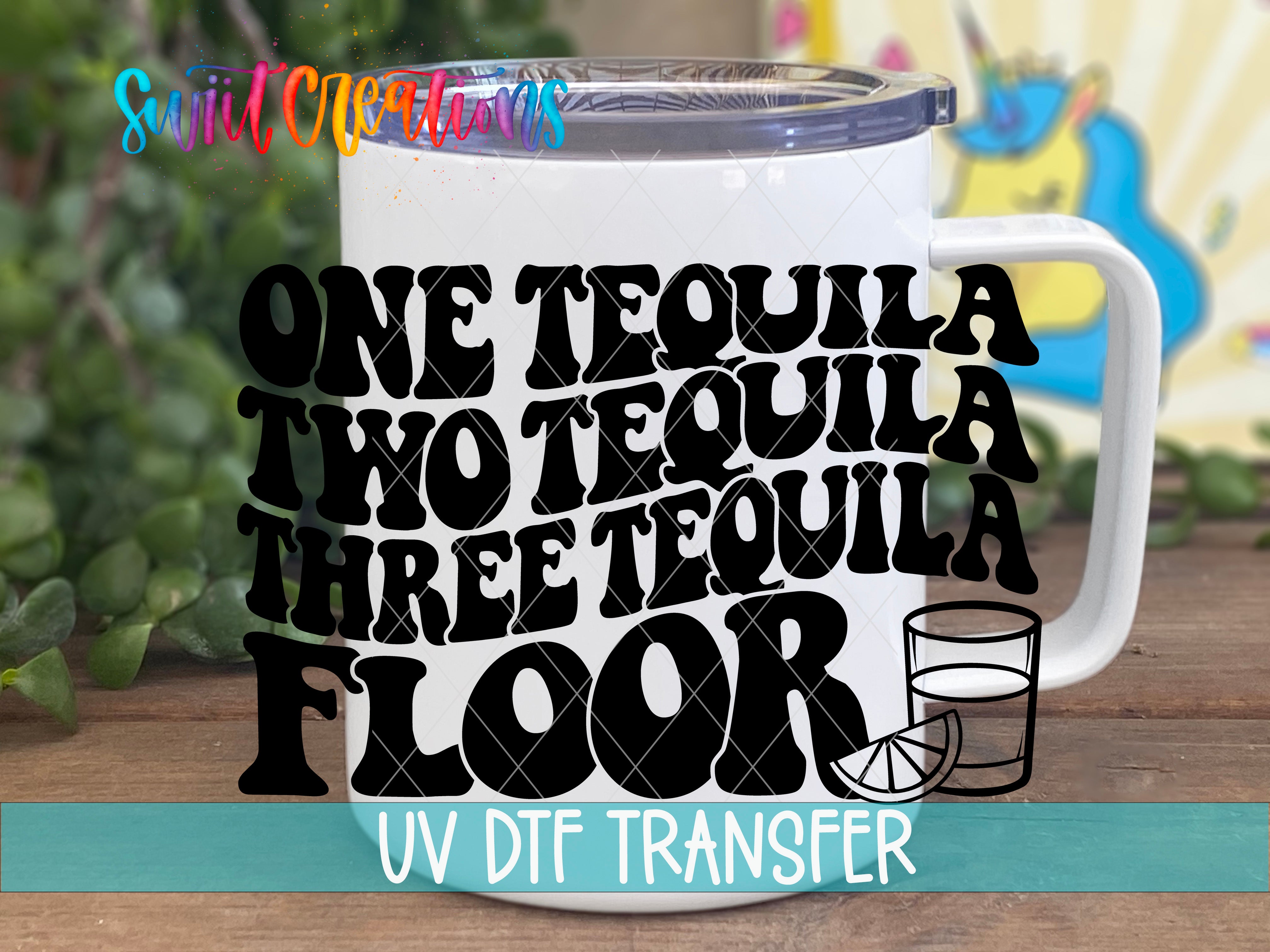 A white mug with the text "ONE TEQUILA TWO TEQUILA THREE TEQUILA FLOOR" printed on it, along with a graphic of a tequila glass and a lime slice.