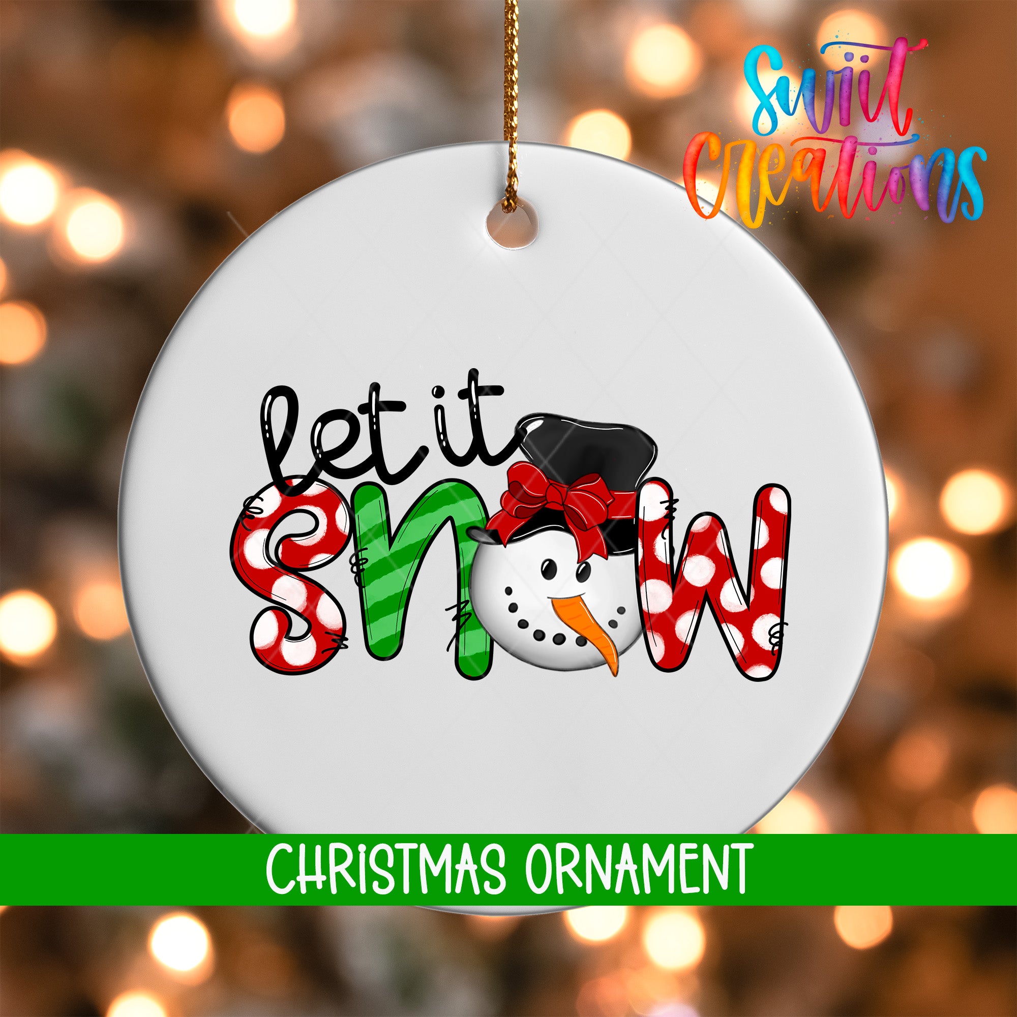 A white Christmas ornament with the text "let it snow" and a snowman graphic.