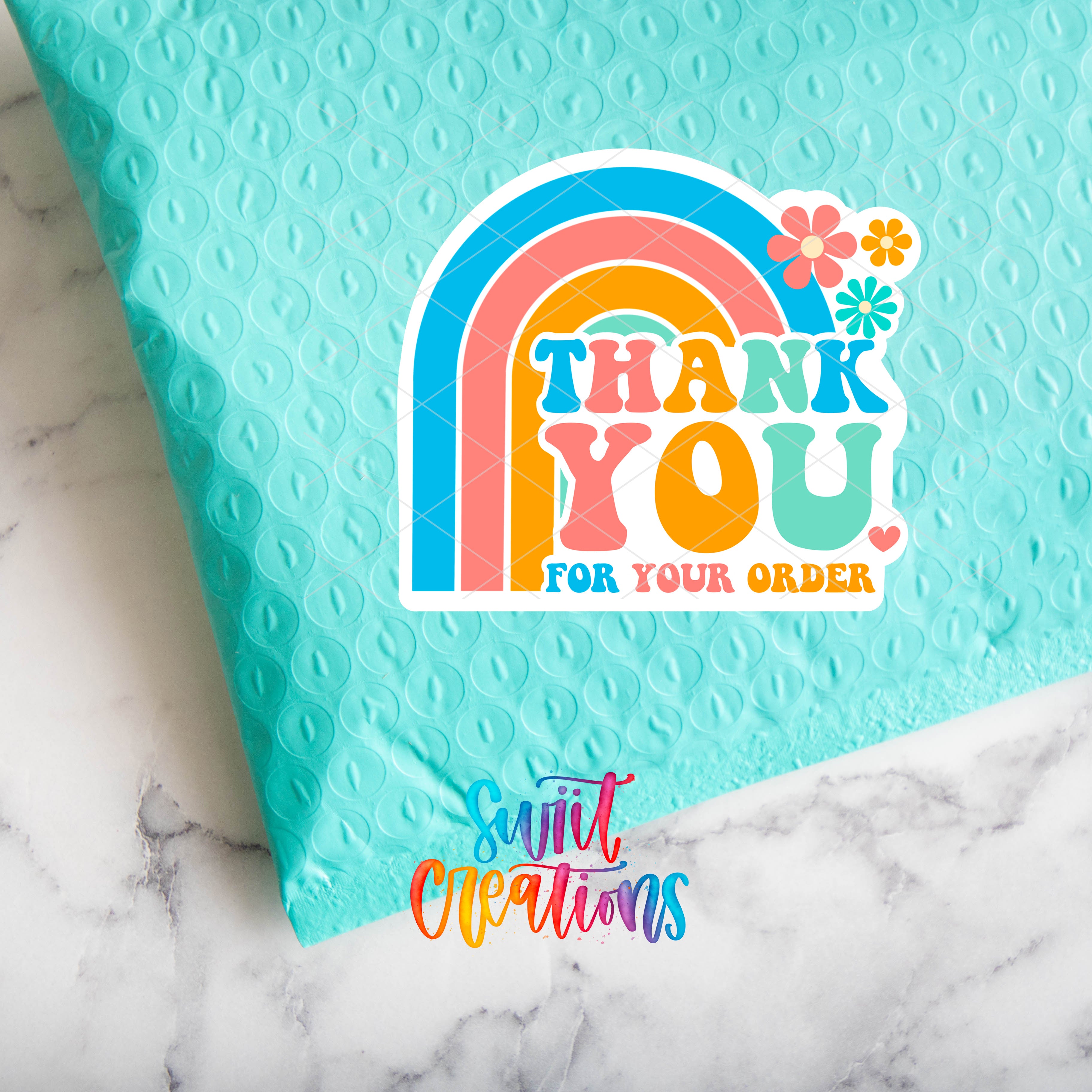 a thank you card with a rainbow on it