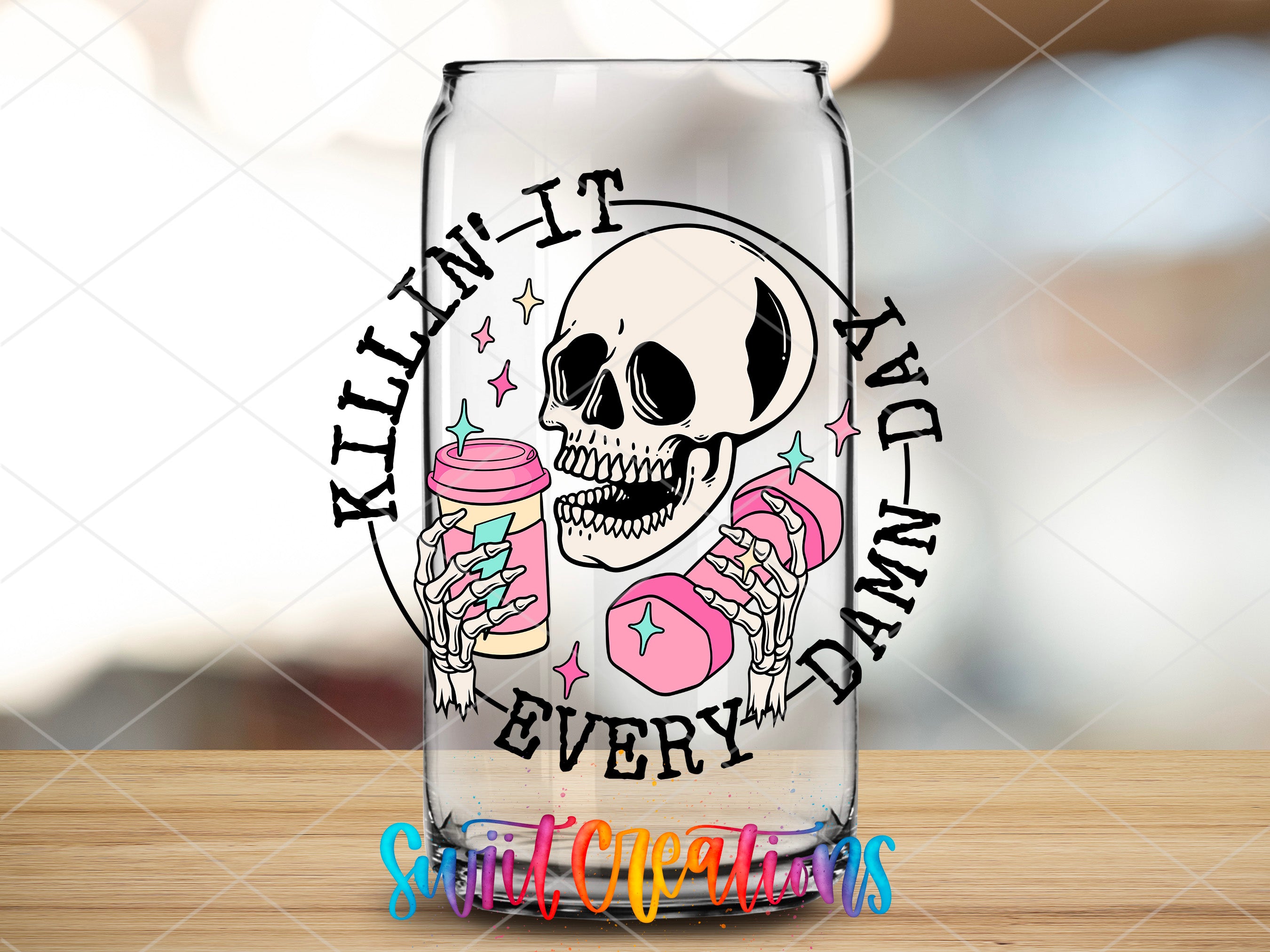 a glass with a skull and donuts on it