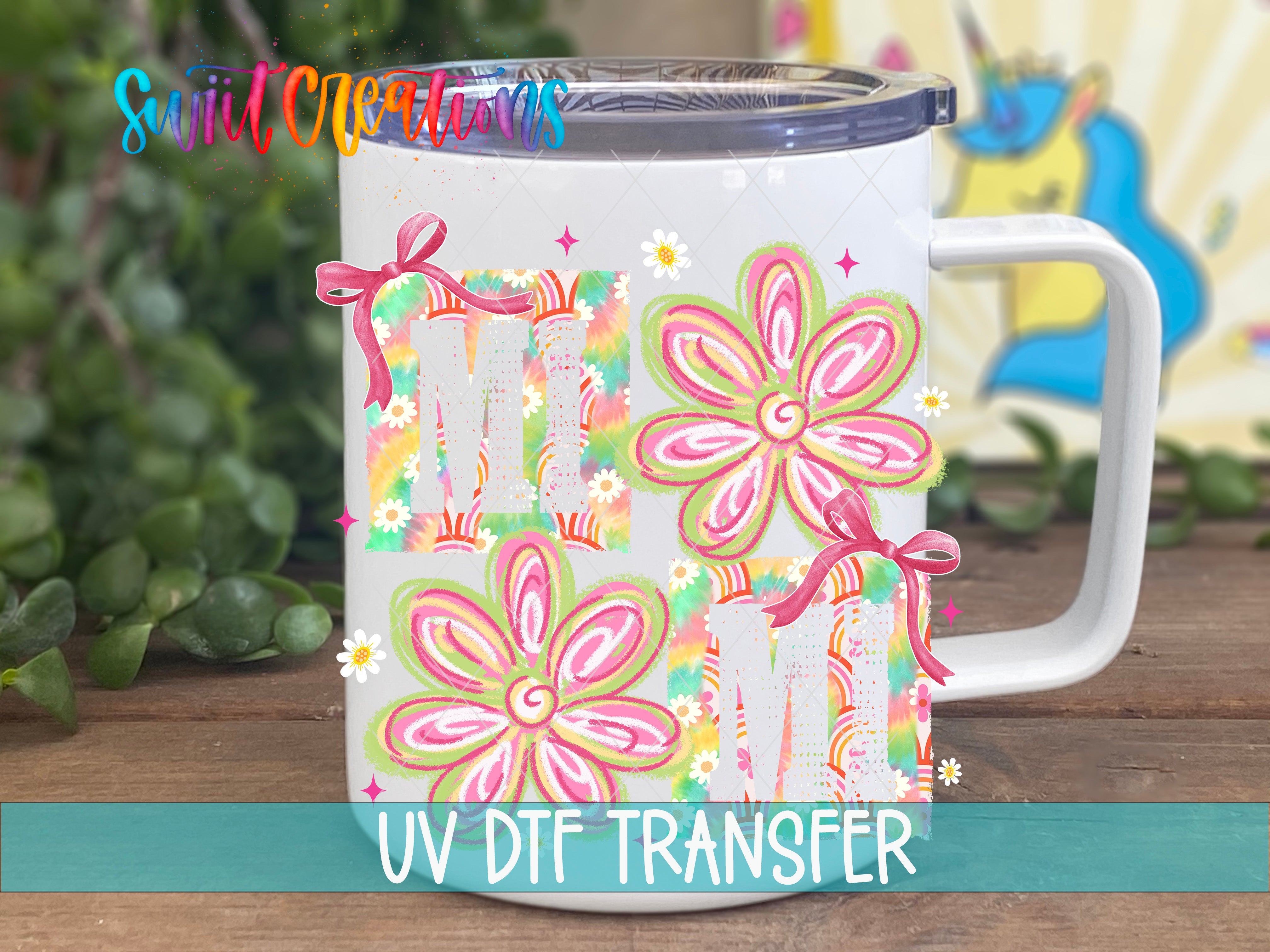 A white mug with colorful floral designs and the text "UV Dtf Transfer" printed on it.