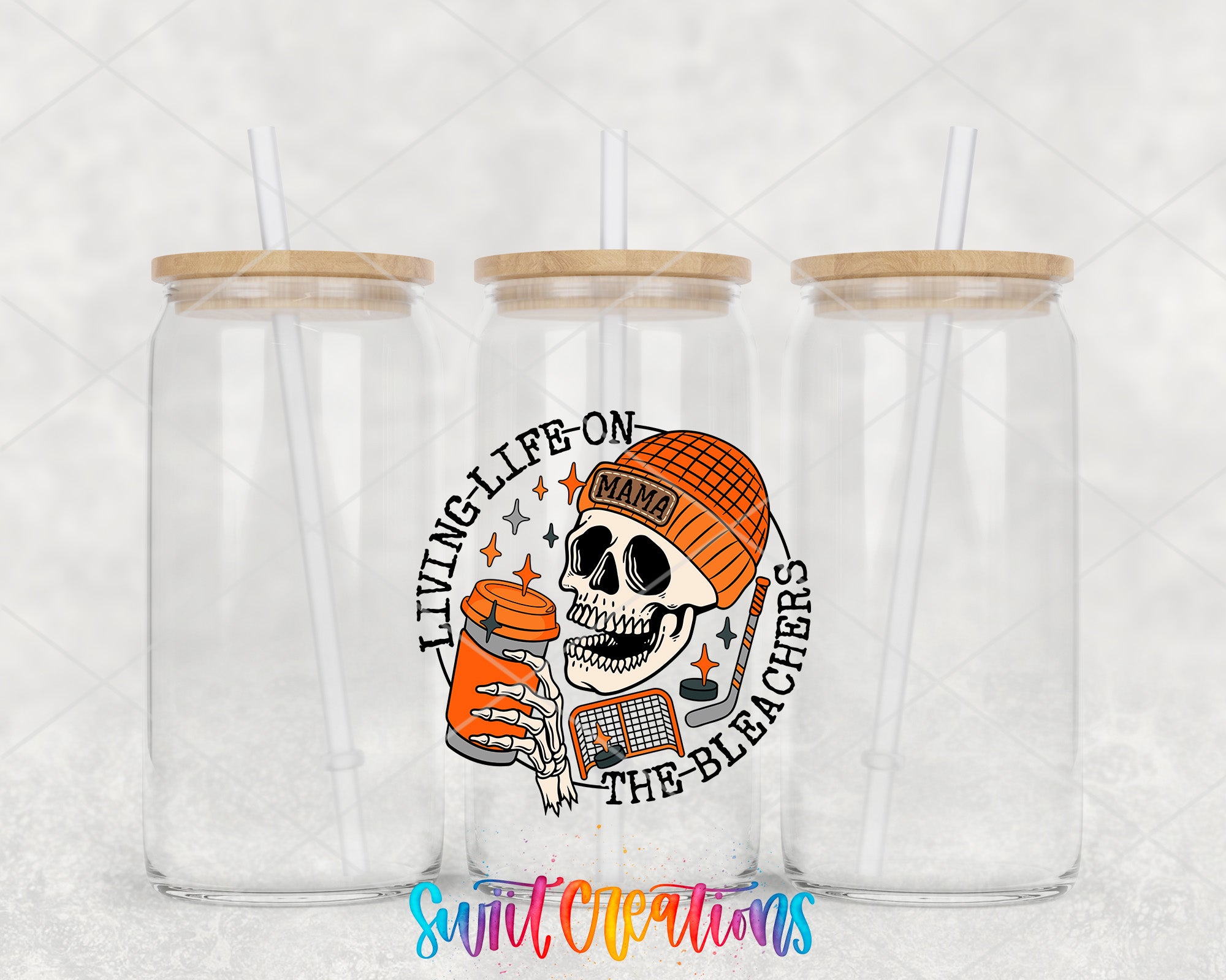 a pair of clear tumblers with a skull on the side