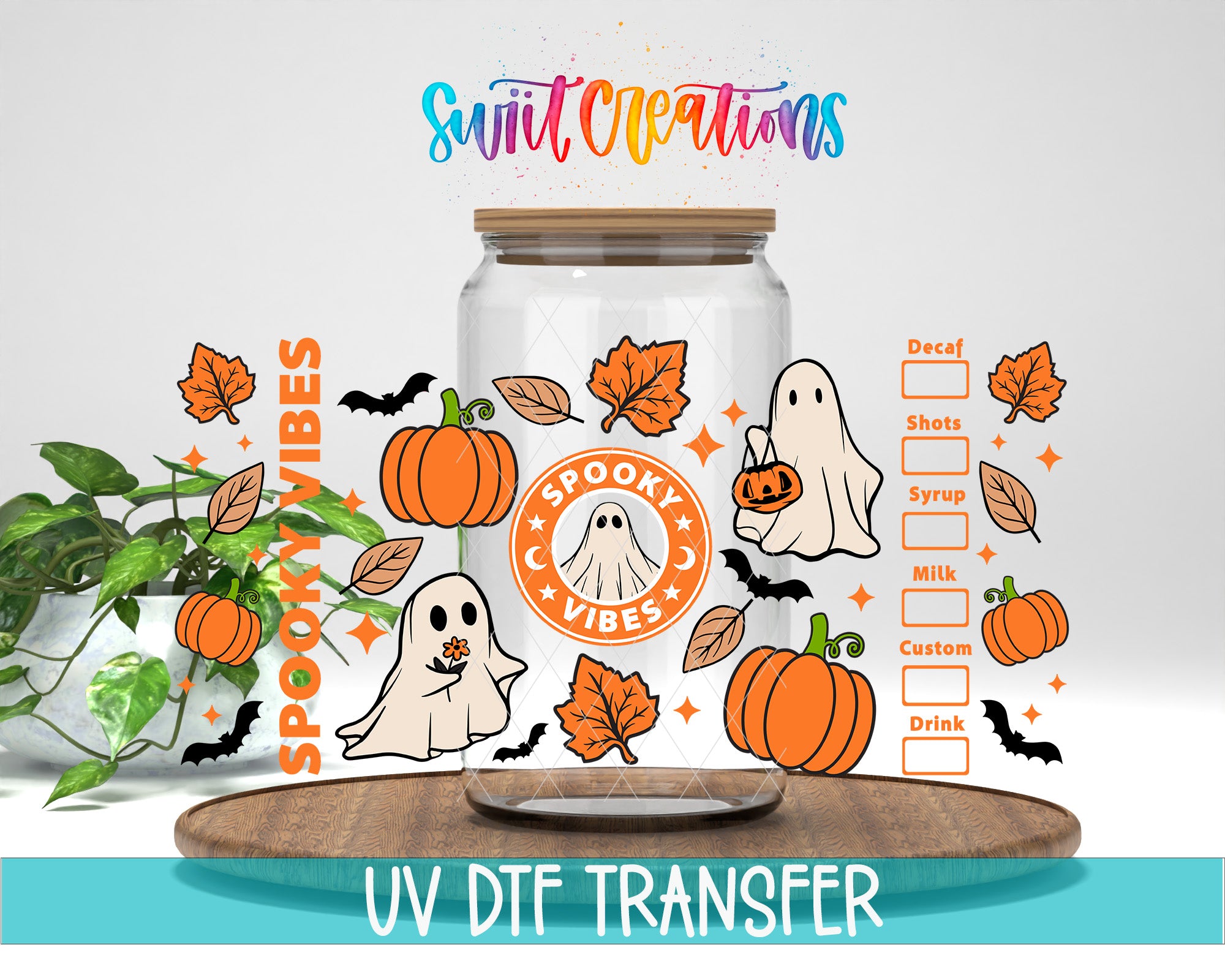 a Halloween-themed mug with a glass jar, pumpkins, bats, and a ghost. The mug has a label that says "SPOOKY VIBES" and "UV DFT TRANSFER".