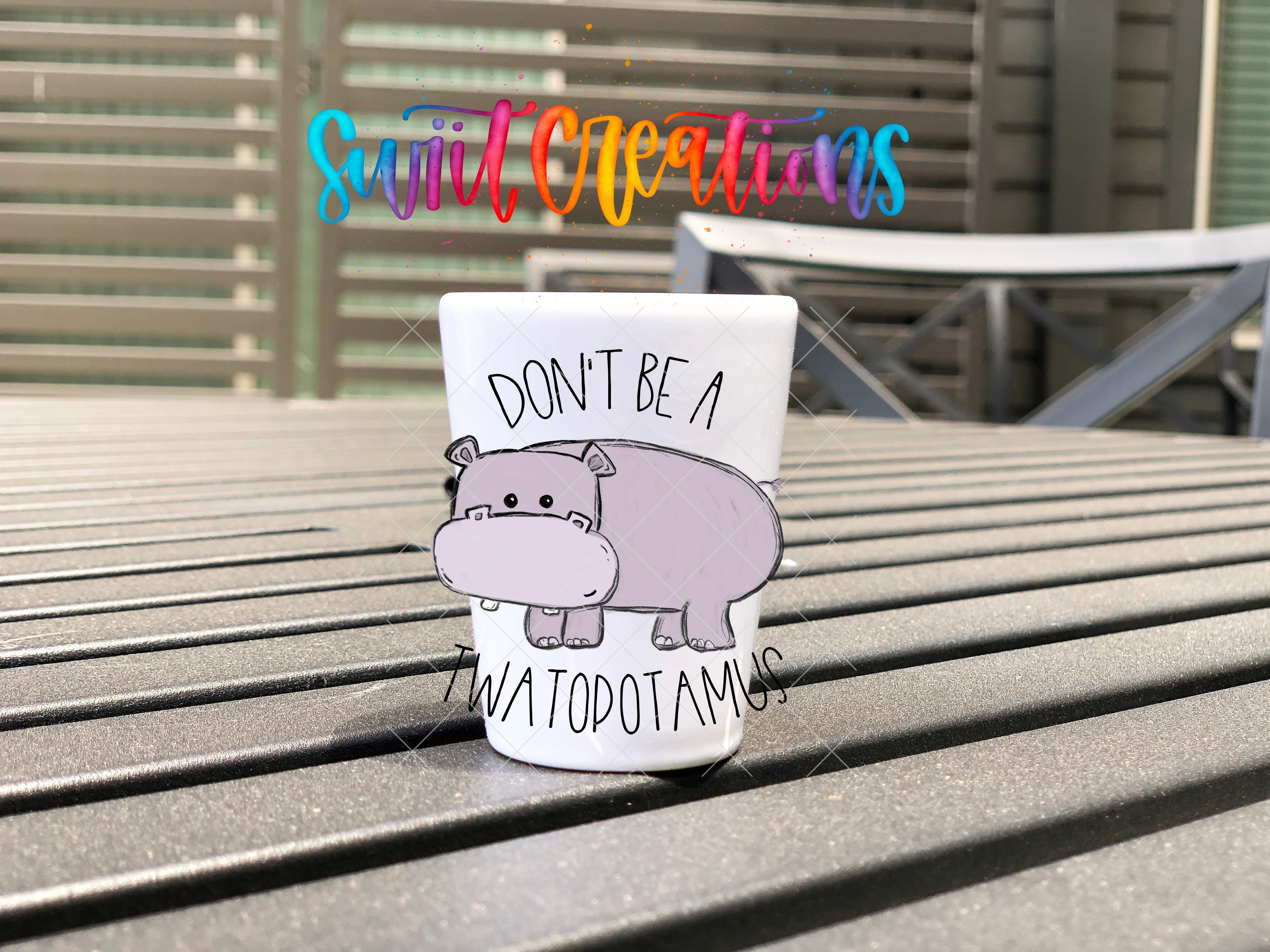 a coffee cup that has a hippo on it