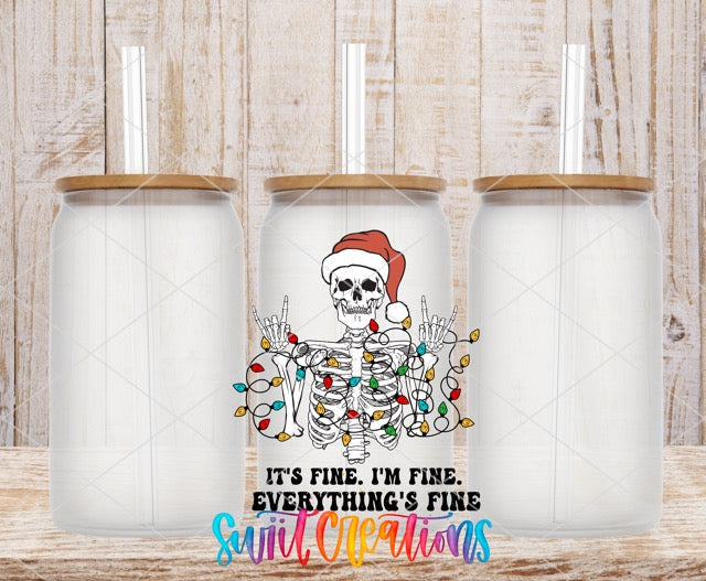two white coffee mugs with a skeleton wearing a santa hat