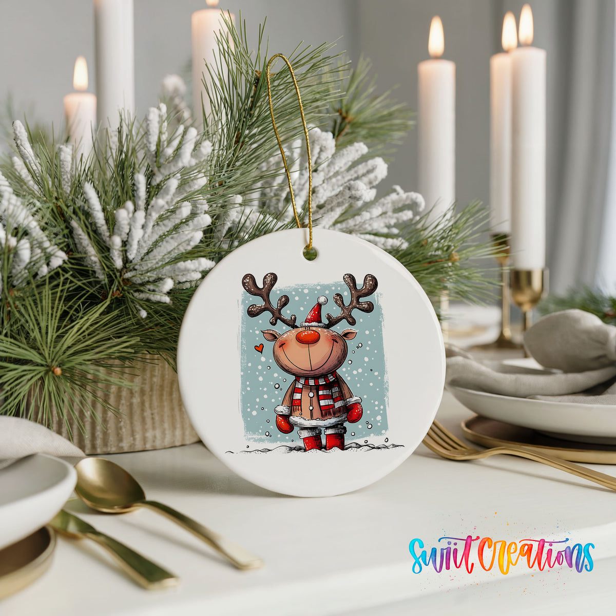 A white ceramic ornament featuring a cartoon reindeer with antlers, surrounded by pine branches and candles, placed on a table with other tableware.