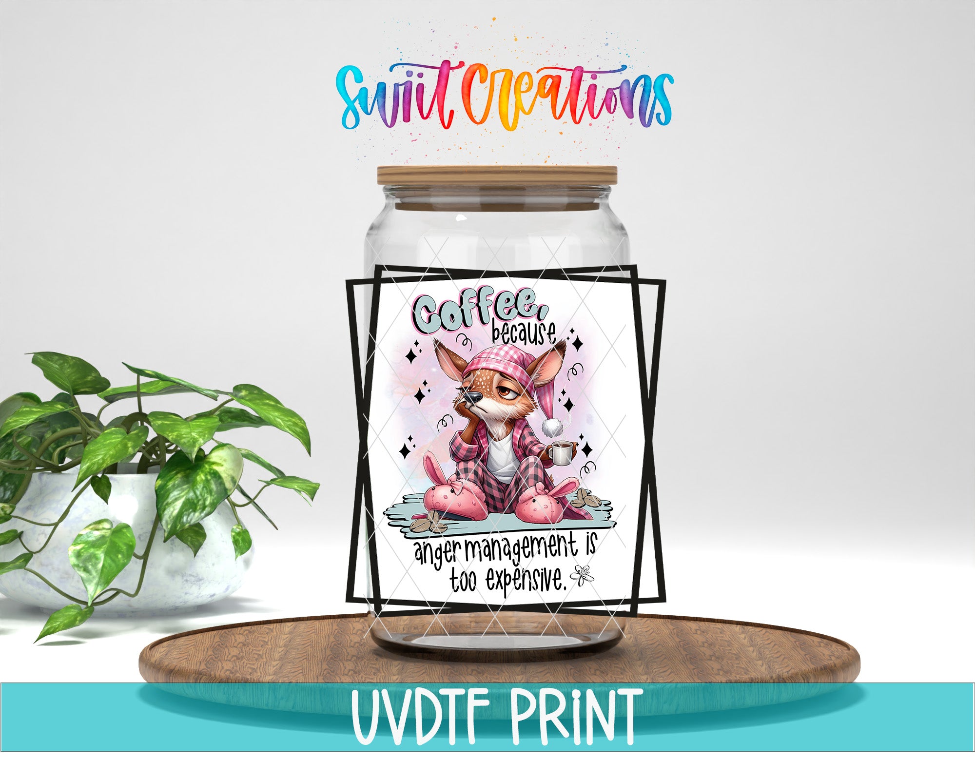 a jar with a label that says "Coffee because anger management is too expensive" and includes a cartoon image of a cat. The jar is placed on a wooden tray, and there is a potted plant in the background.