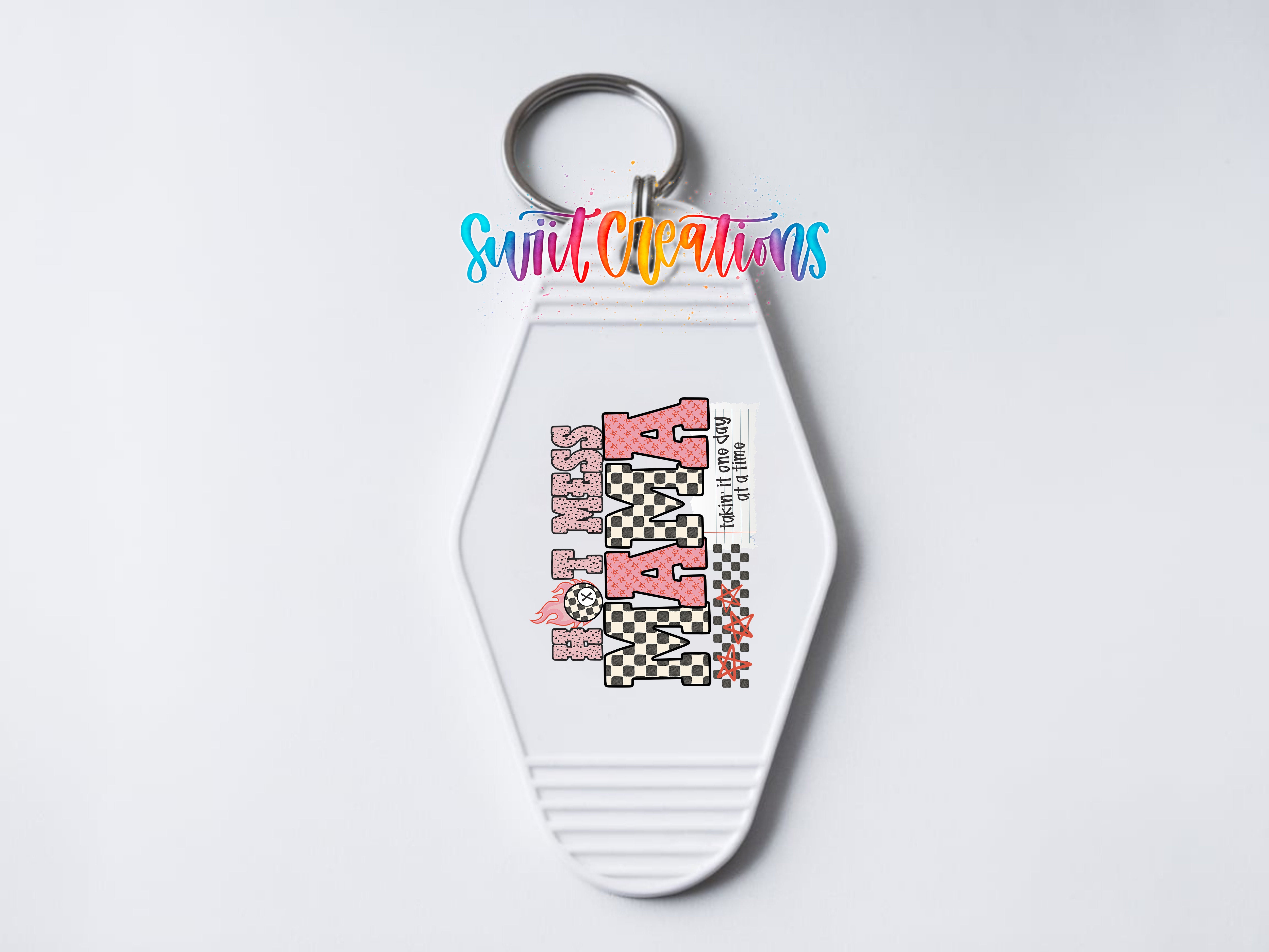 A keychain with a design featuring the text "HAPPY NANA" and a checkered pattern.