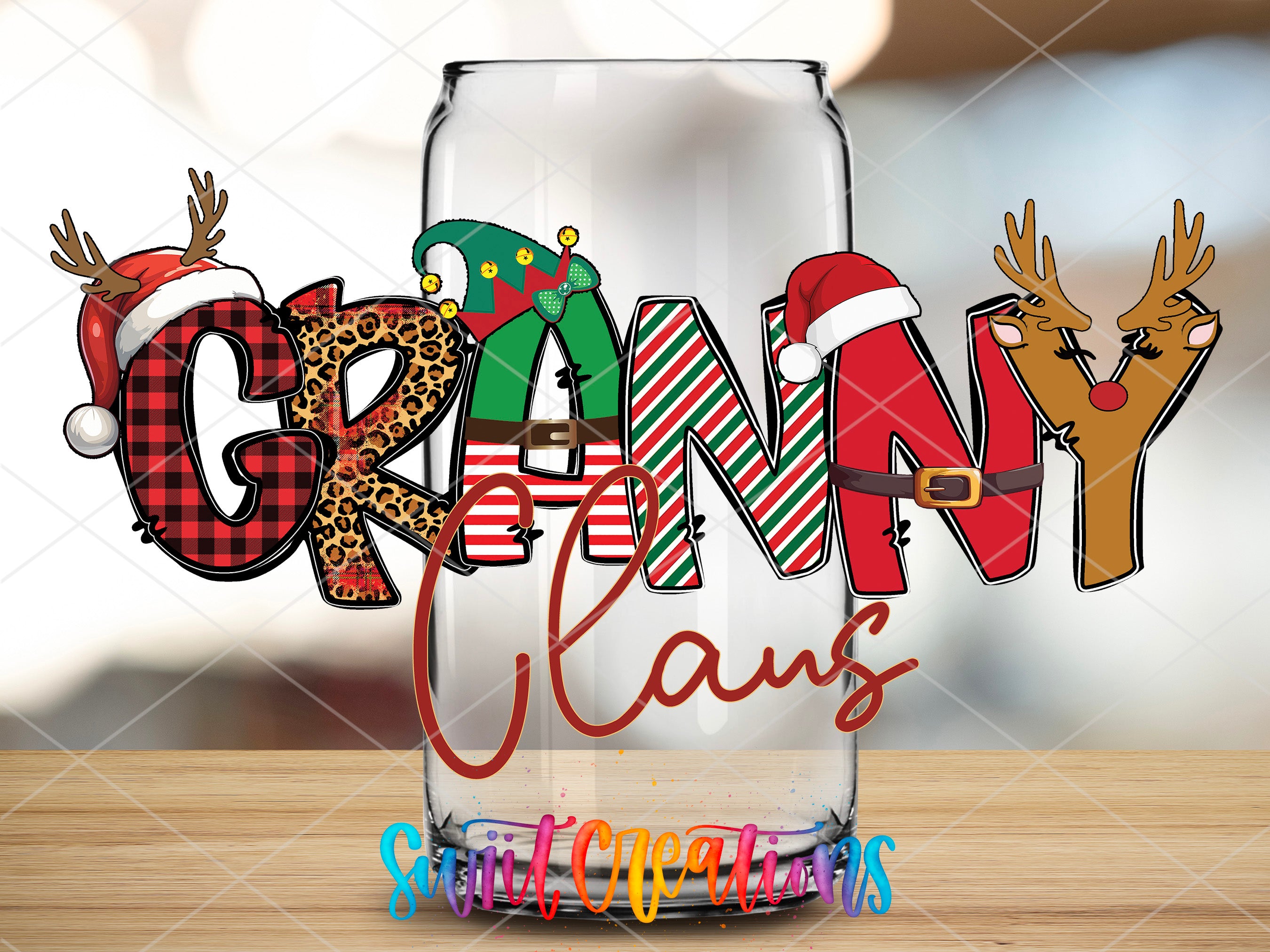 a glass filled with christmas decorations on top of a table