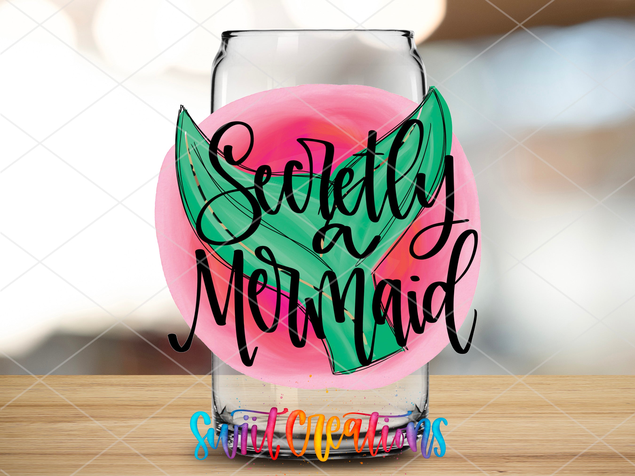 a glass with some writing on it sitting on a table