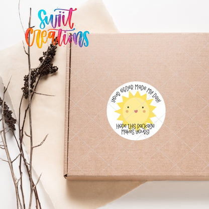 a box with a sticker of a sun on it