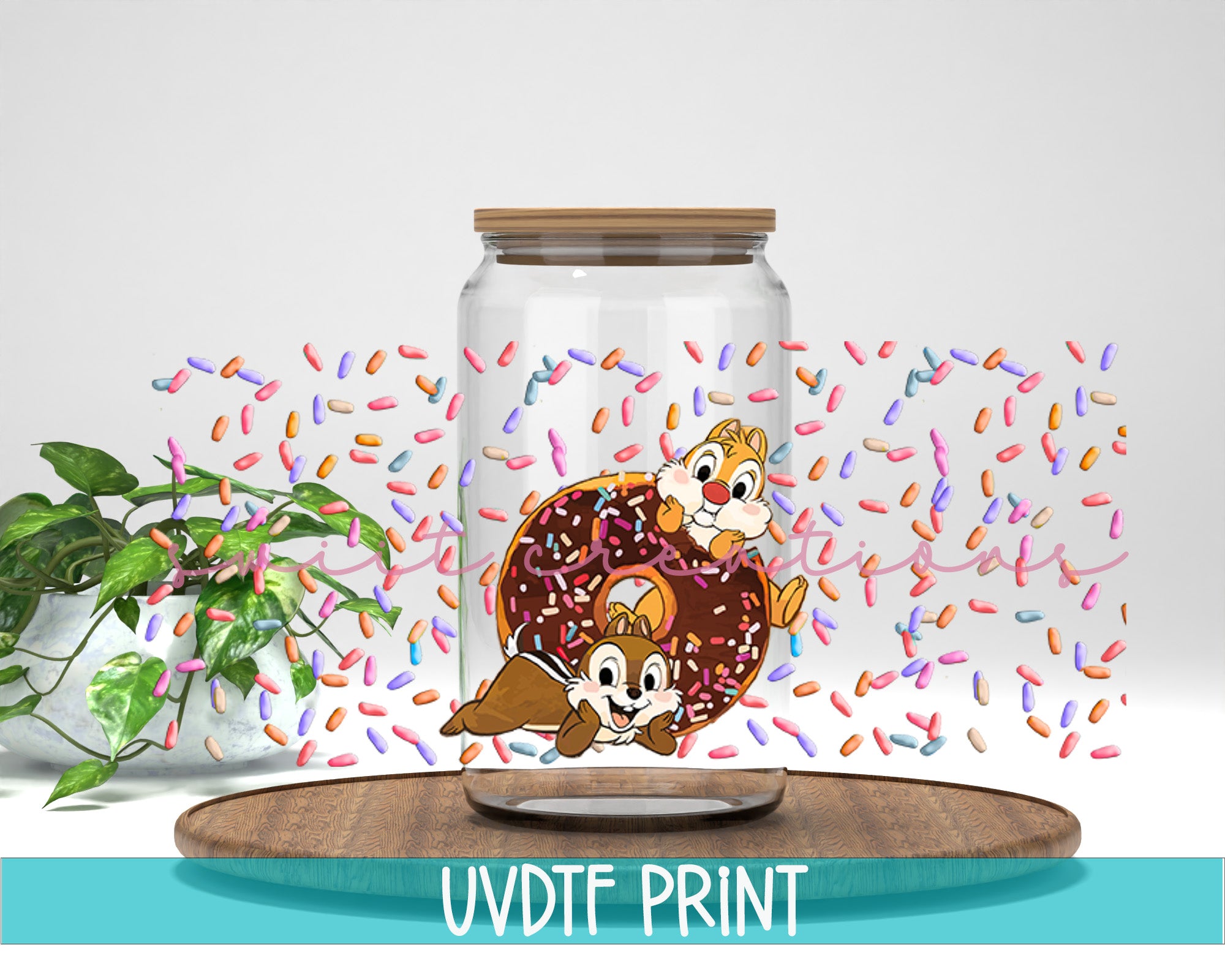 a glass jar filled with a donut and sprinkles