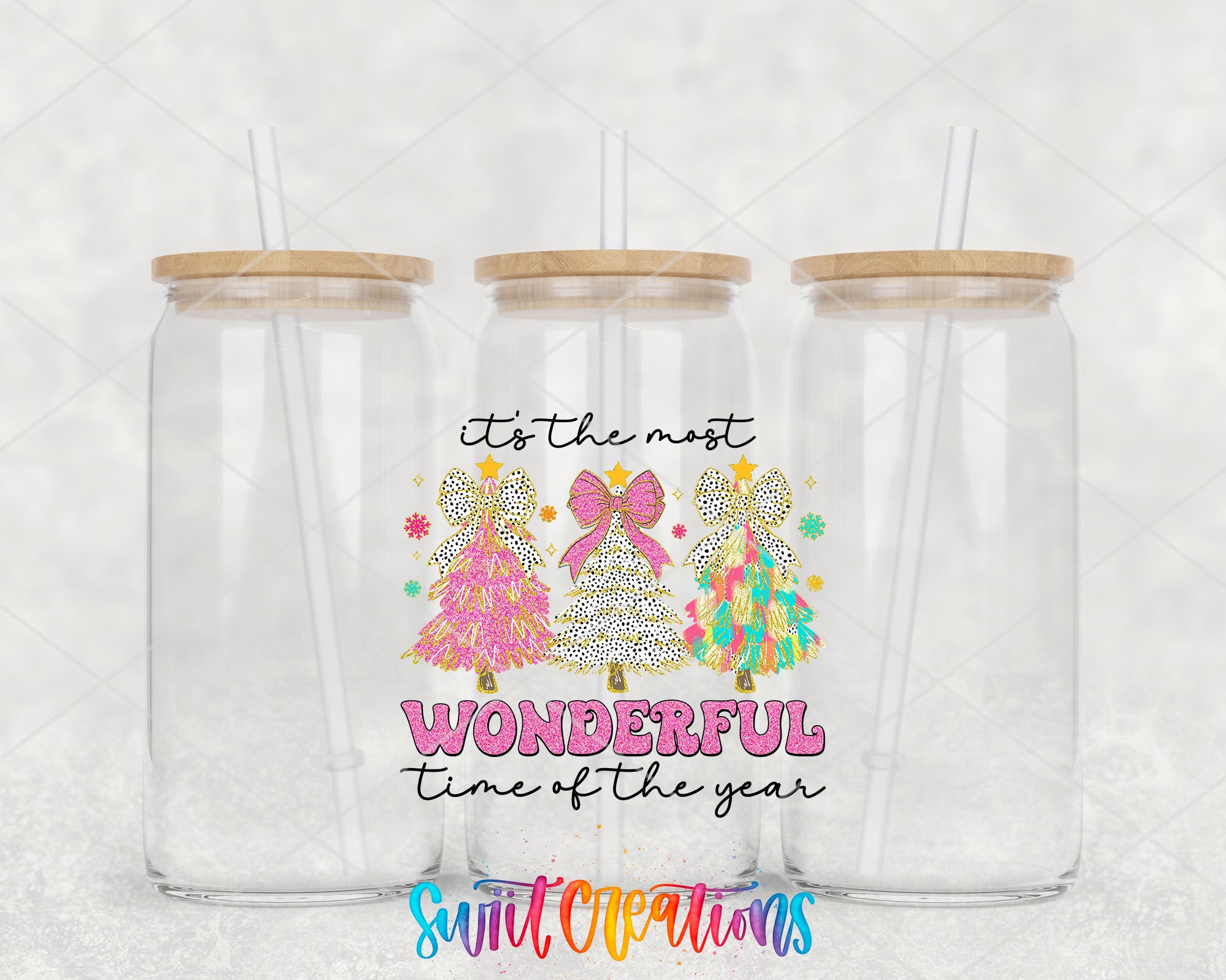 two clear tumblers with wooden lids and a pink bow