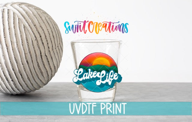 a ball of yarn next to a glass of water