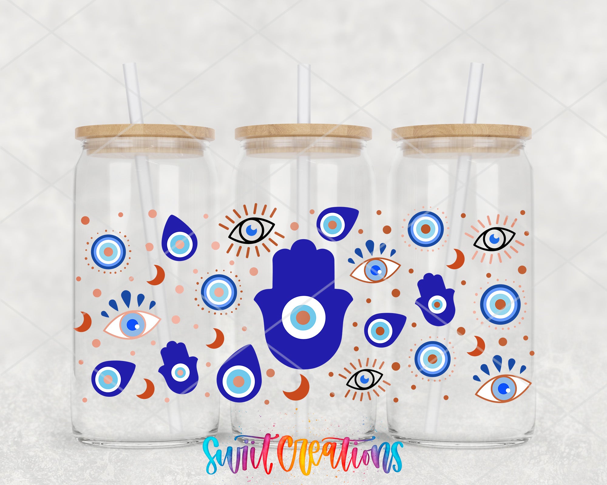 three glass jars with colorful and whimsical designs, including eyes, hands, and other symbols, along with straws.