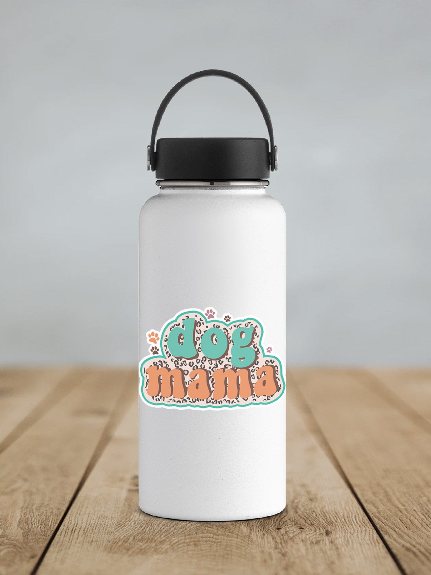 a white water bottle sitting on top of a wooden table