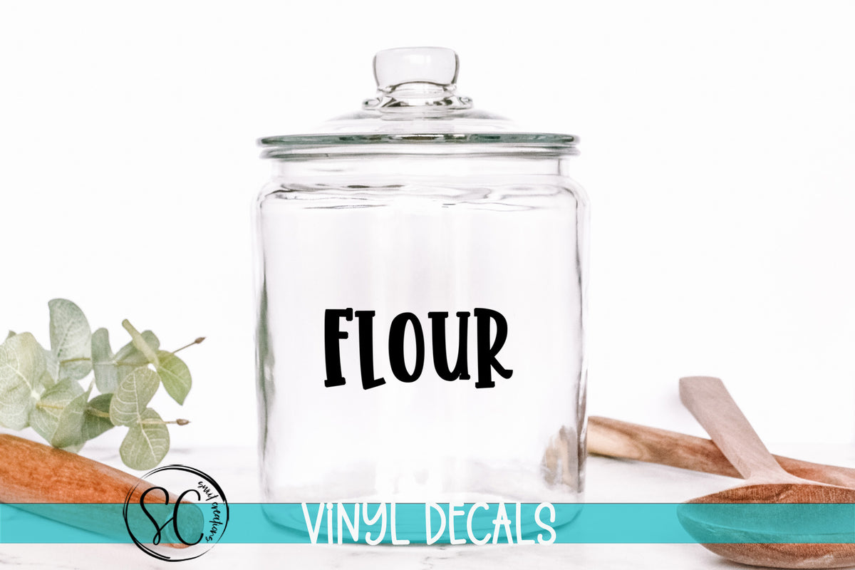 a glass jar with the word flour written on it