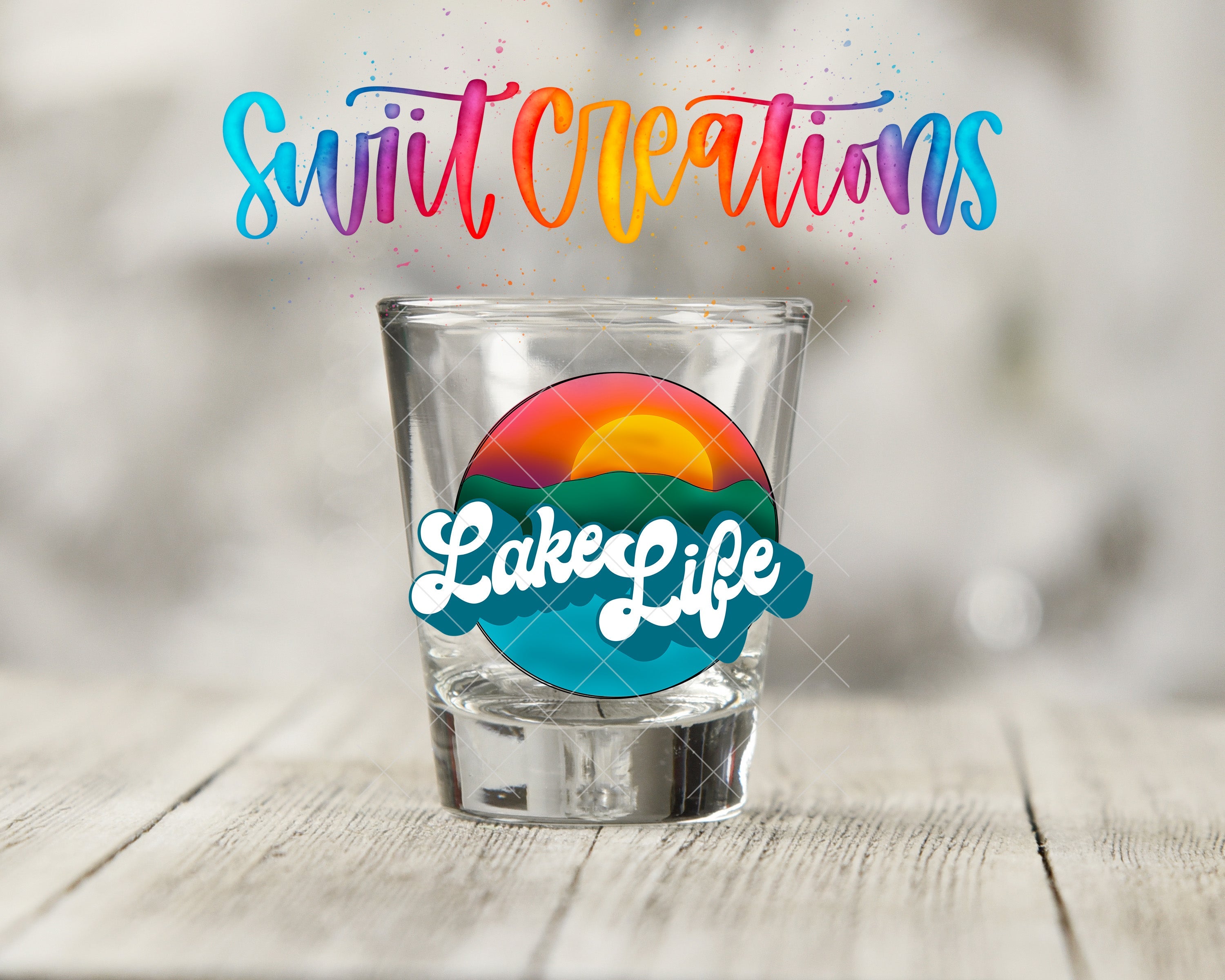 a shot glass sitting on top of a wooden table