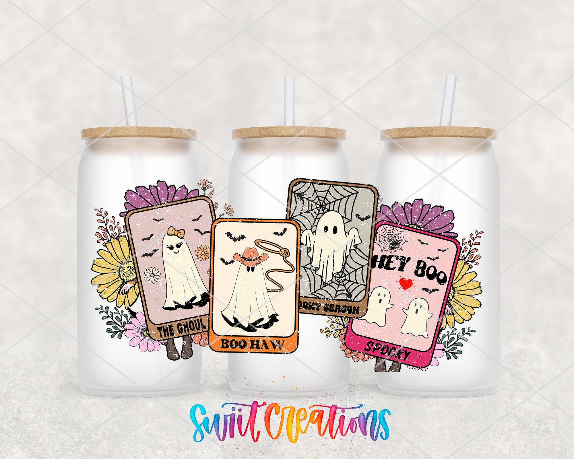 three glass tumblers with Halloween-themed designs, including ghost images and floral decorations.